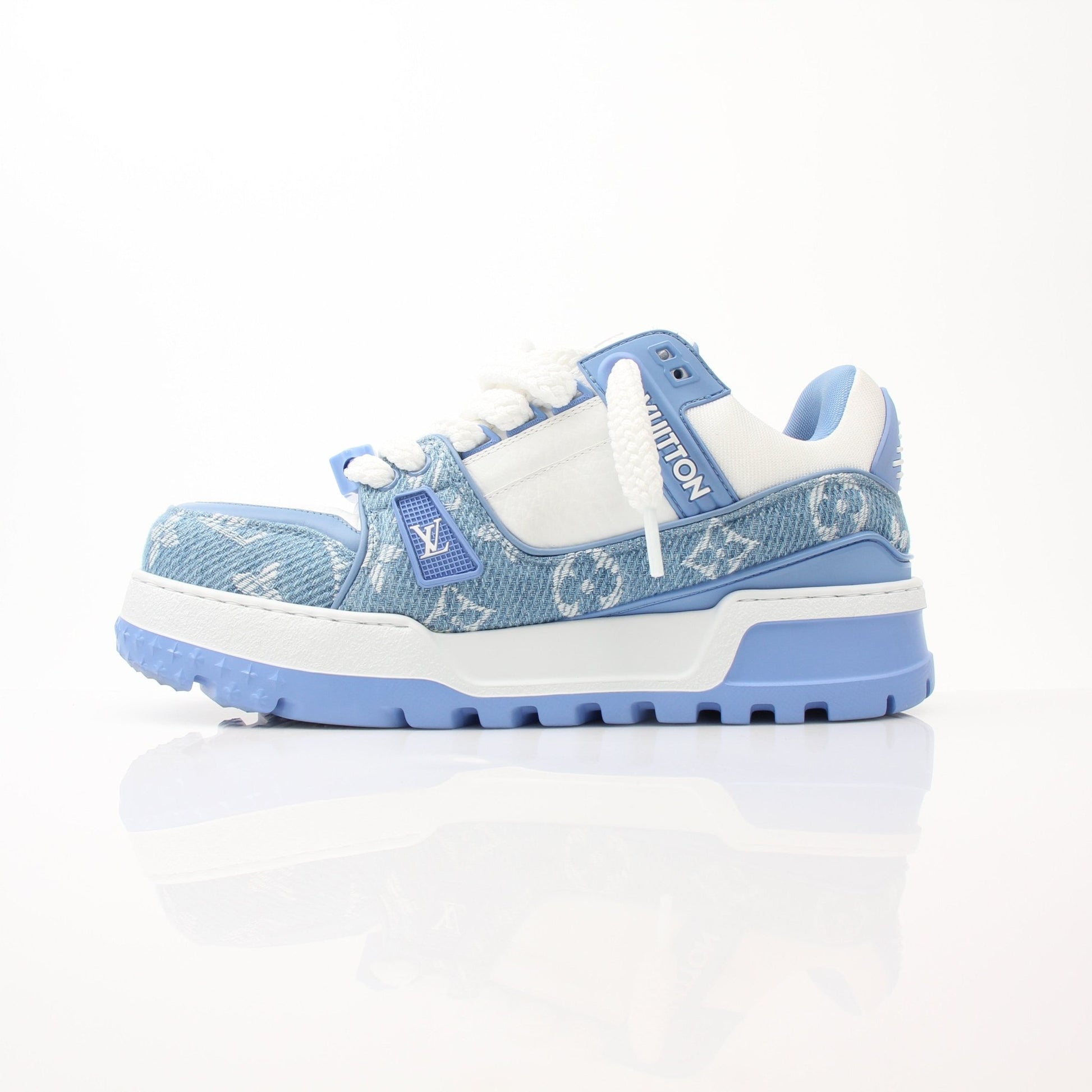 Louis Vuitton Maxi Sneakers by Gold & Beyond, stylish shoes with white and gold accents, detailed laces, and branded design.