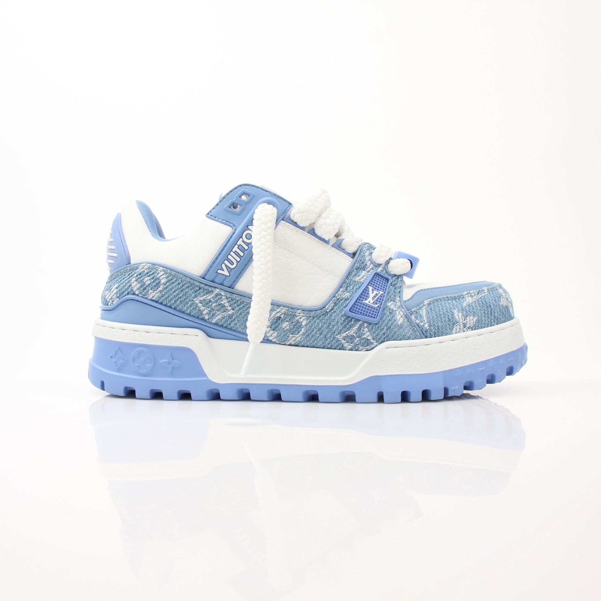 Gold & Beyond Louis Vuitton Maxi Sneakers featuring white leather upper, gold accents, and chunky rubber sole.