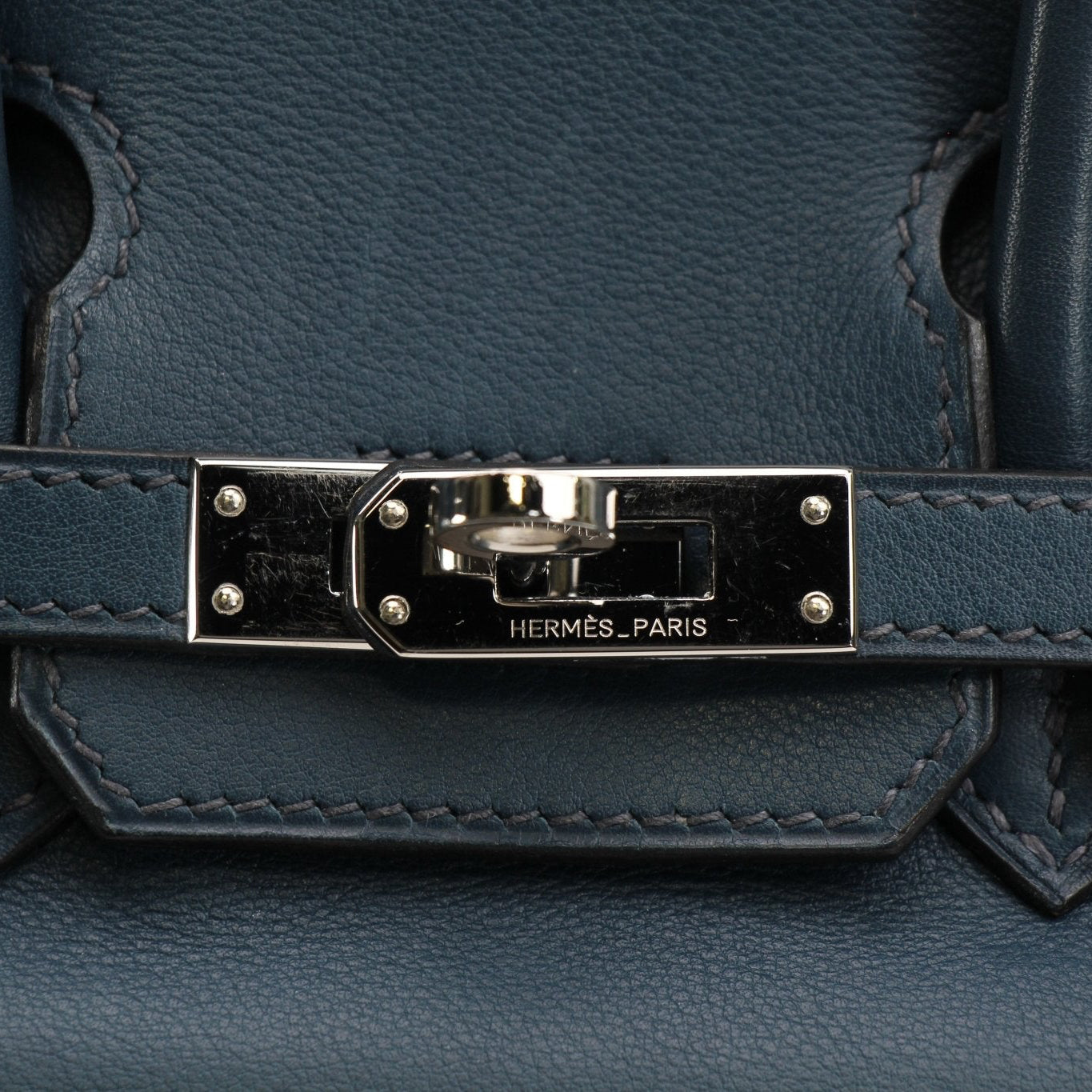 Hermès Birkin 25 blue handbag with gold hardware, showcasing luxurious leather and elegant design by Gold & Beyond.