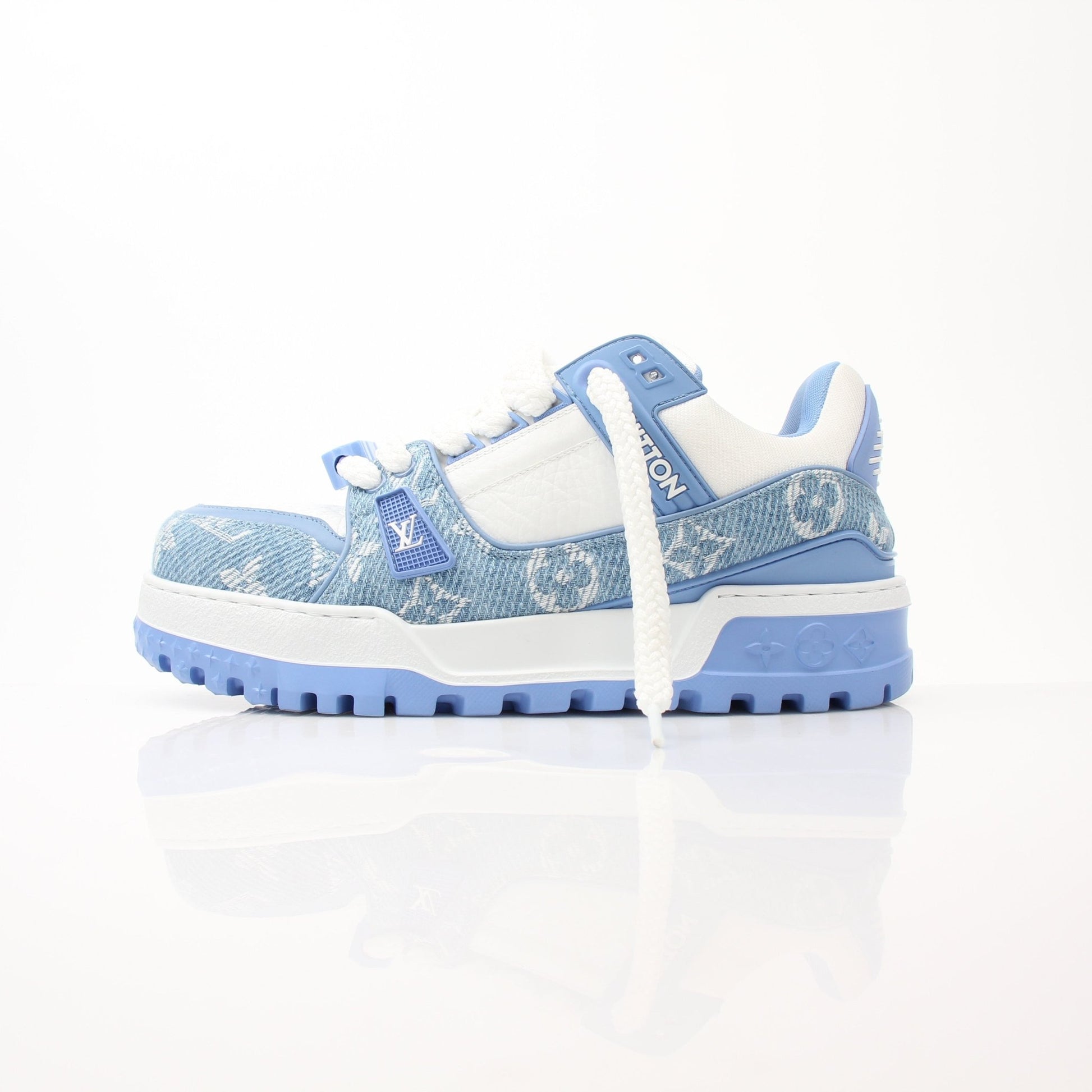 Gold & Beyond Louis Vuitton Maxi Sneakers, stylish shoes featuring a sleek design and luxury branding, displayed on a flat surface.