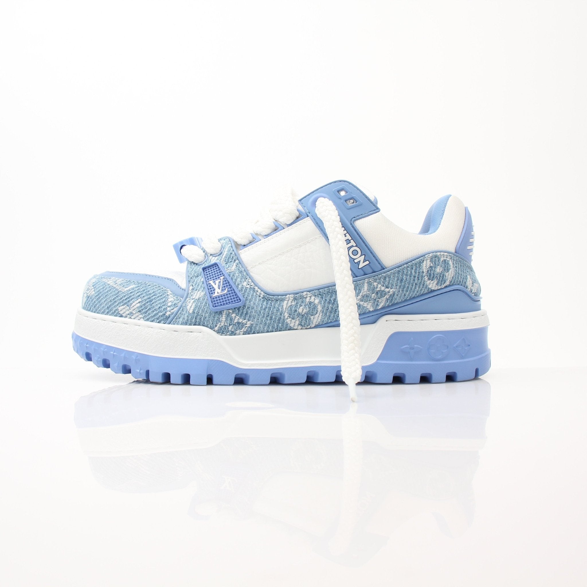 Gold & Beyond Louis Vuitton Maxi Sneakers, stylish shoes featuring a sleek design and luxury branding, displayed on a flat surface.