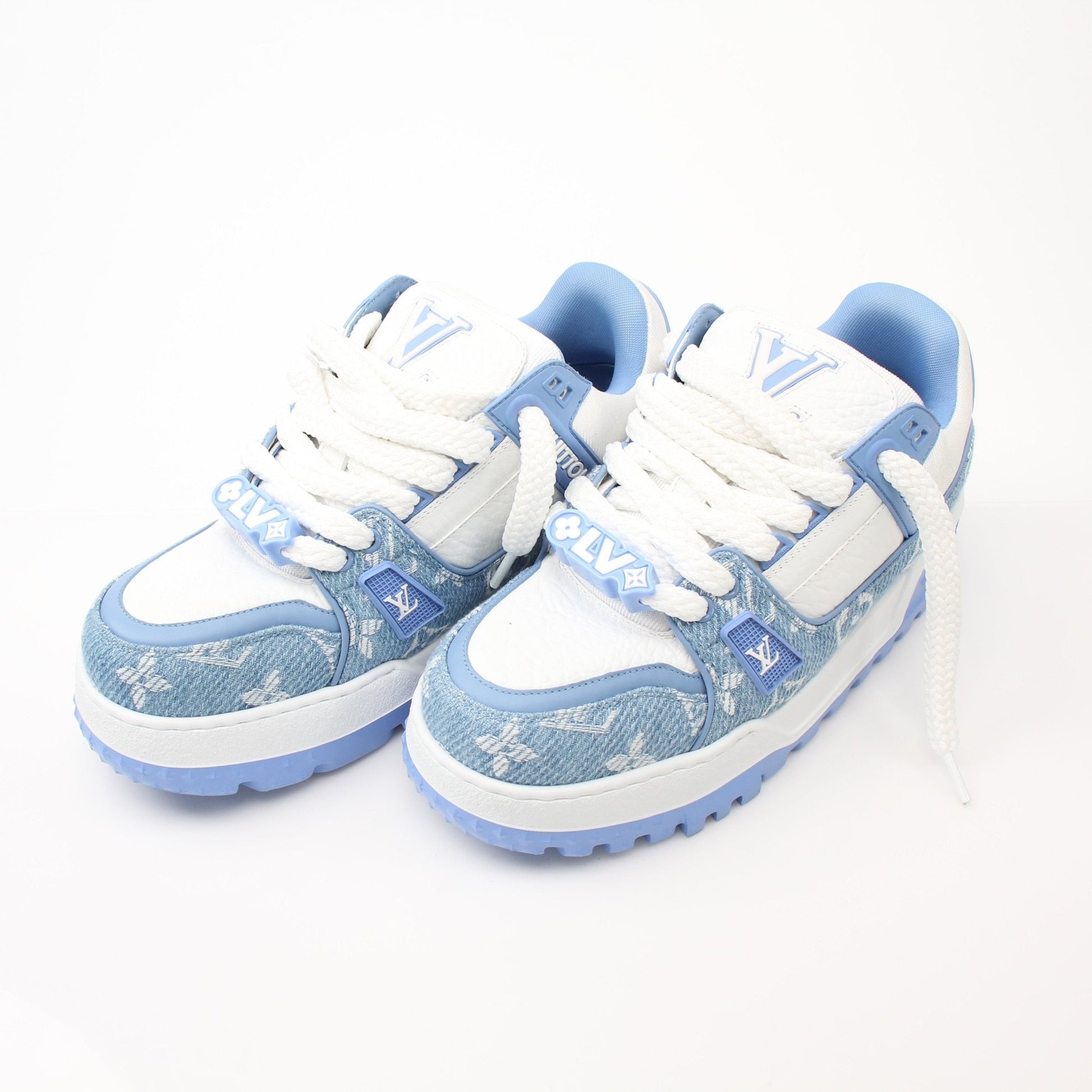 Louis Vuitton Maxi Sneakers in white and gold, stylish shoes with bold design details from Gold & Beyond.