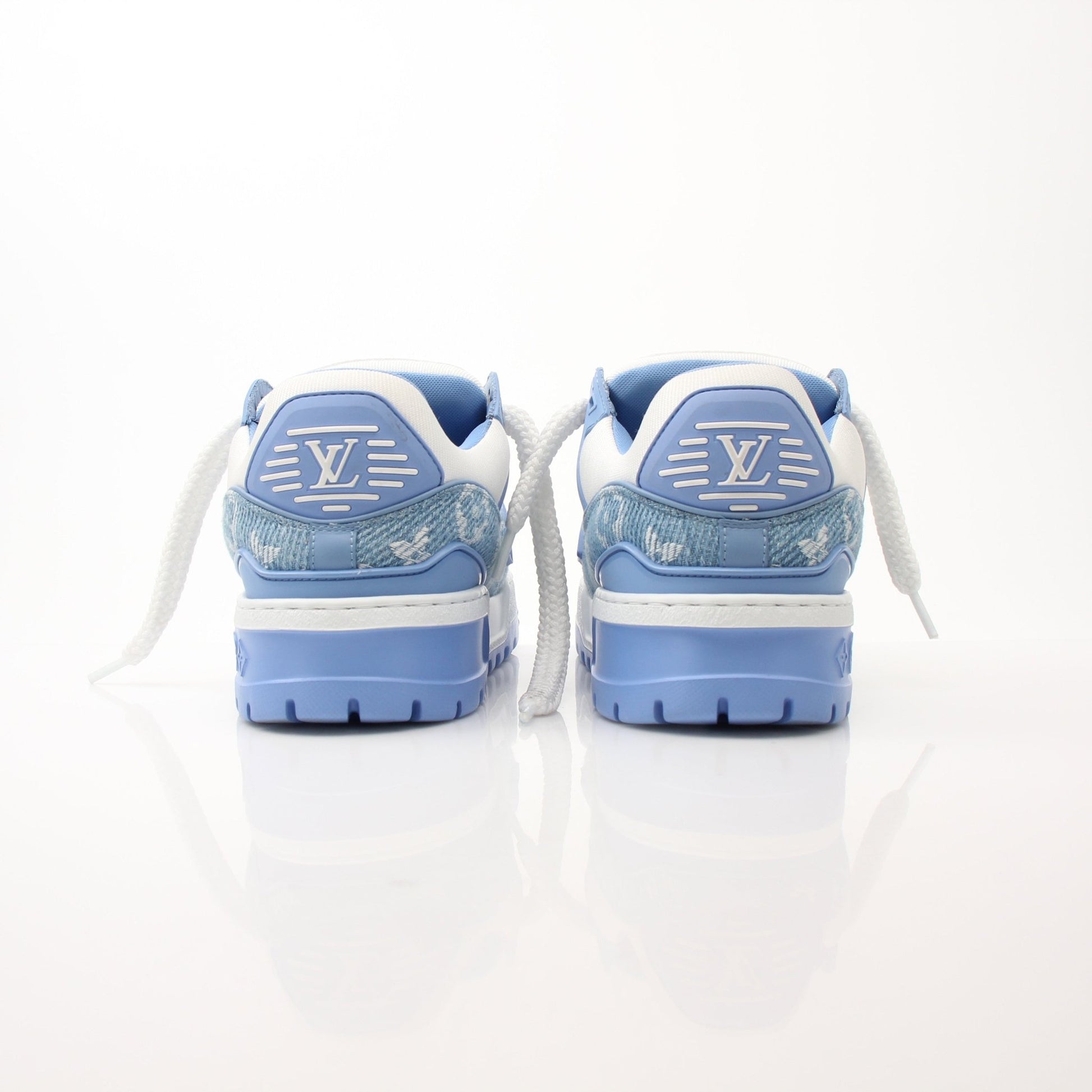 Louis Vuitton Maxi Sneakers by Gold & Beyond, stylish white shoes with LV branding and chunky sole, displayed on a neutral background.