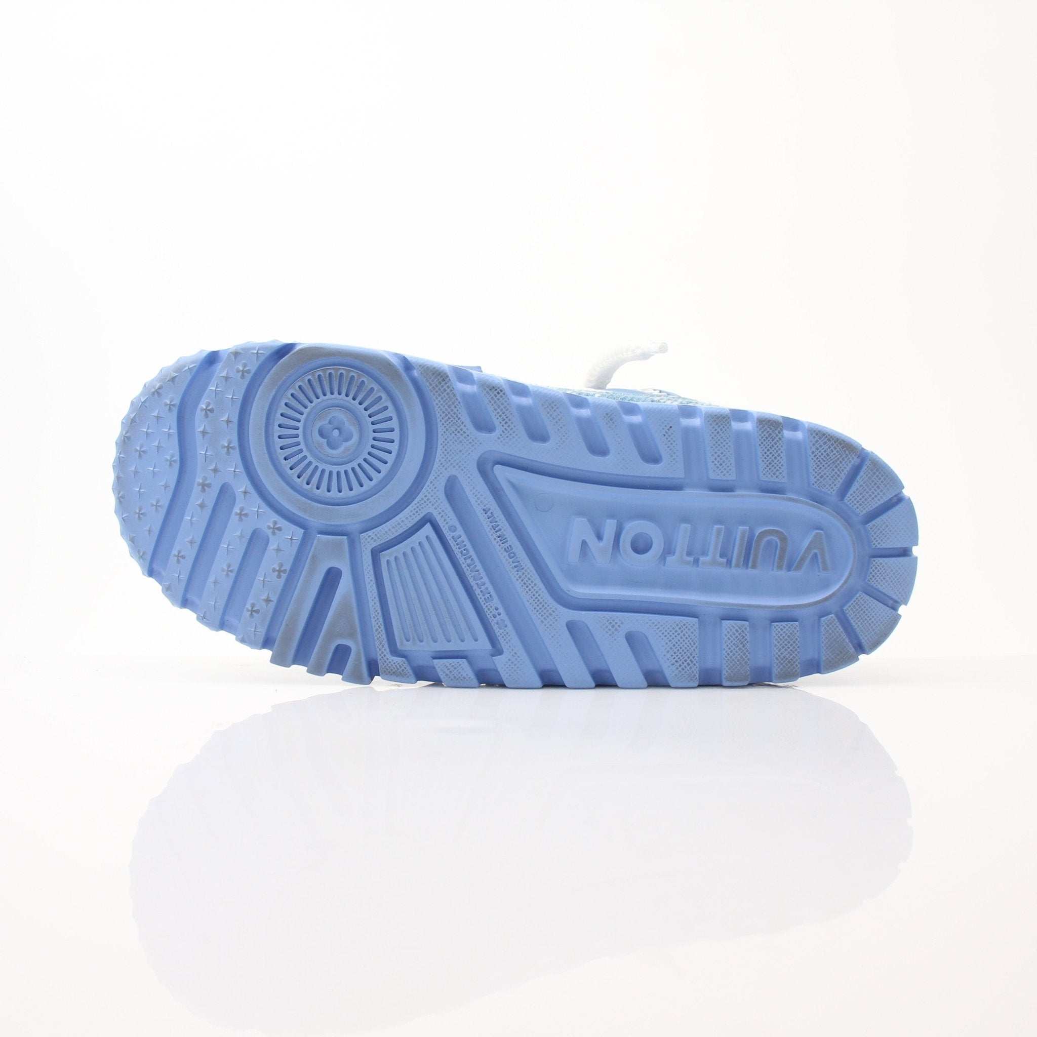 Gold & Beyond Louis Vuitton Maxi Sneakers, stylish white shoes with logo details, displayed on a neutral background.