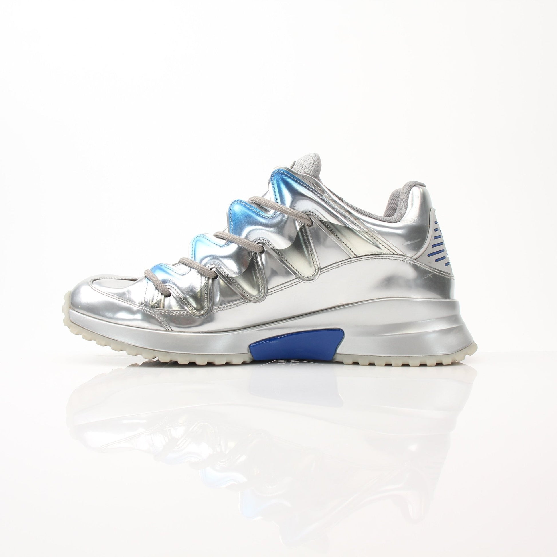 Gold & Beyond Louis Vuitton Zig Zag Sneakers, stylish shoes with bold zigzag pattern and white rubber soles.