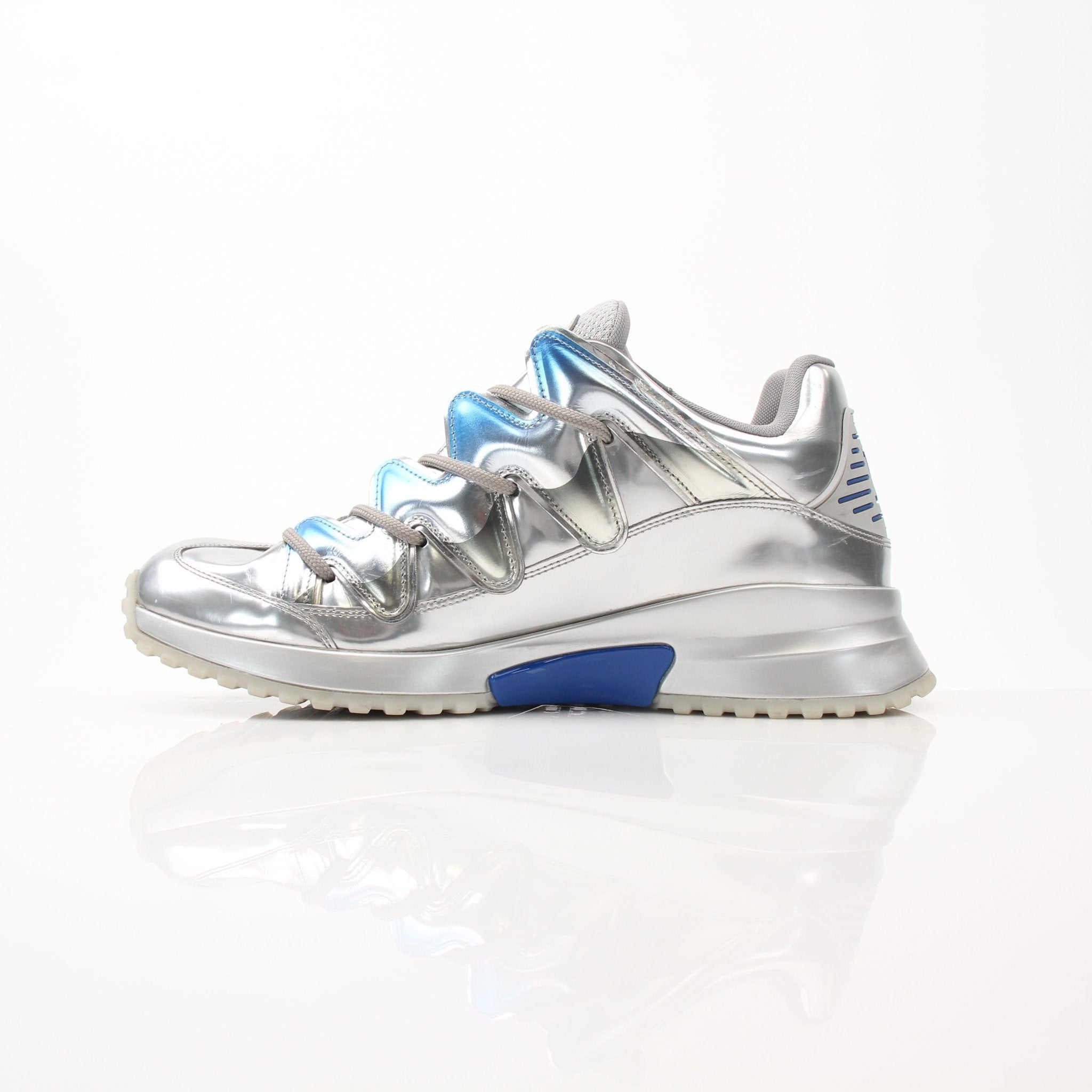 Gold & Beyond Louis Vuitton Zig Zag Sneakers, stylish shoes with bold zigzag pattern and white rubber soles.
