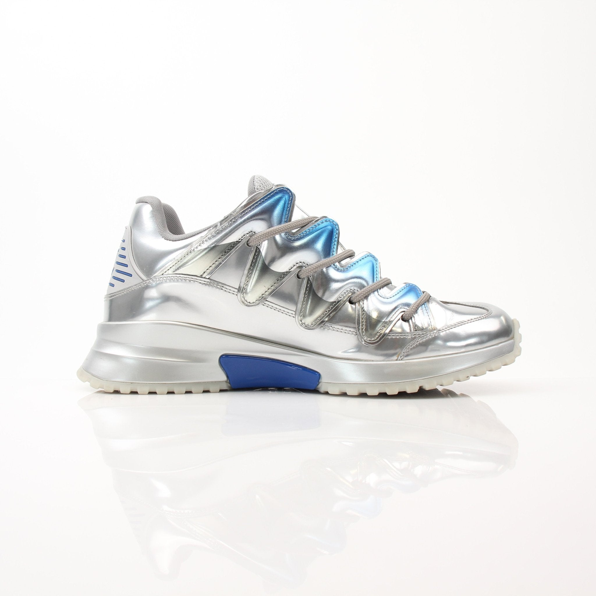 Louis Vuitton Zig Zag Sneakers by Gold & Beyond, stylish shoes with bold zigzag pattern and sleek design, shown from the side.