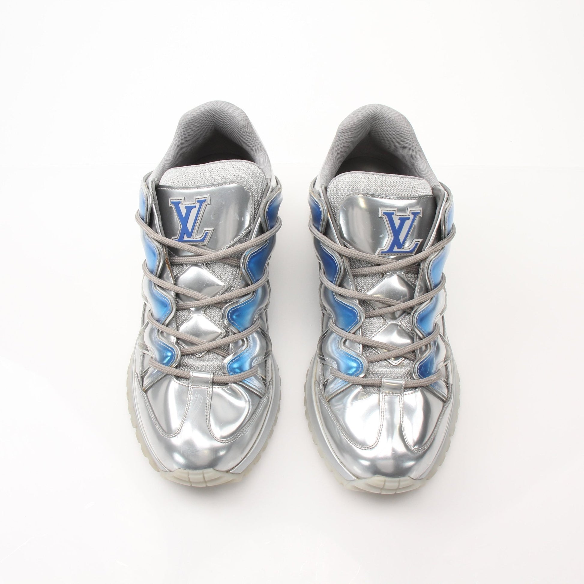 Gold & Beyond Louis Vuitton Zig Zag Sneakers with black and white patterned design, showcasing stylish athletic shoes.