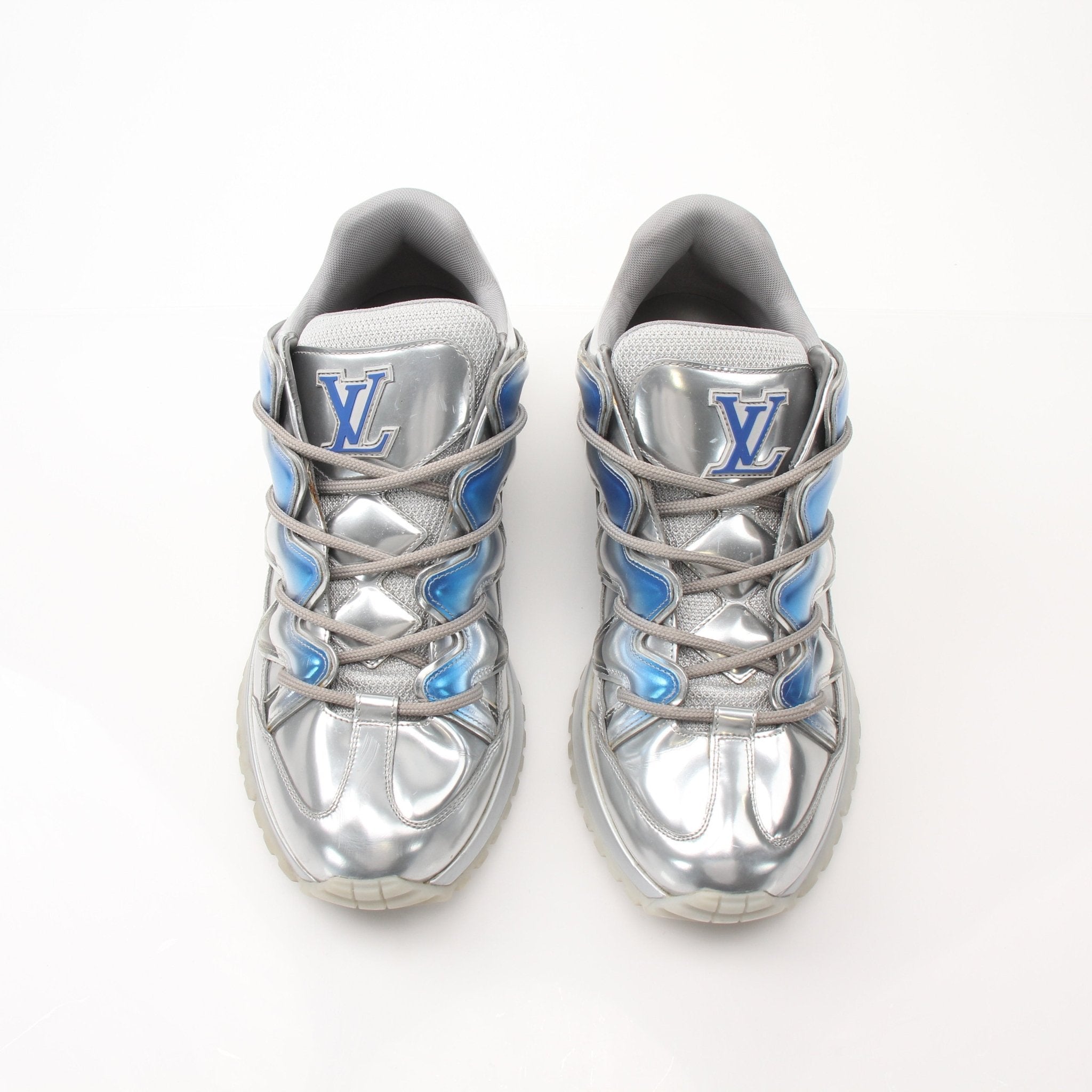 Gold & Beyond Louis Vuitton Zig Zag Sneakers with black and white patterned design, showcasing stylish athletic shoes.