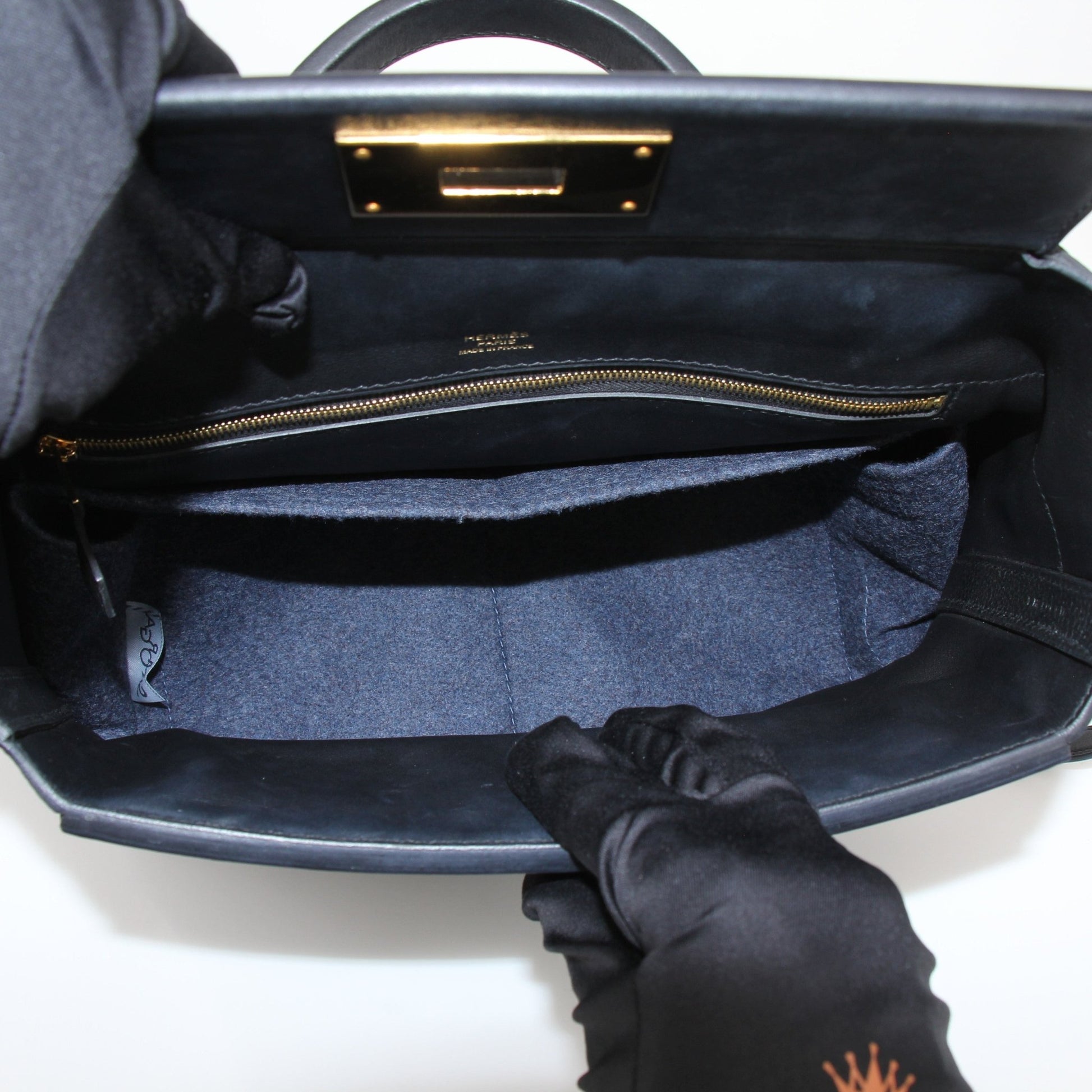 Hermès Top Handle Clemence handbag by Gold & Beyond, featuring a structured leather design with top handles and elegant craftsmanship.