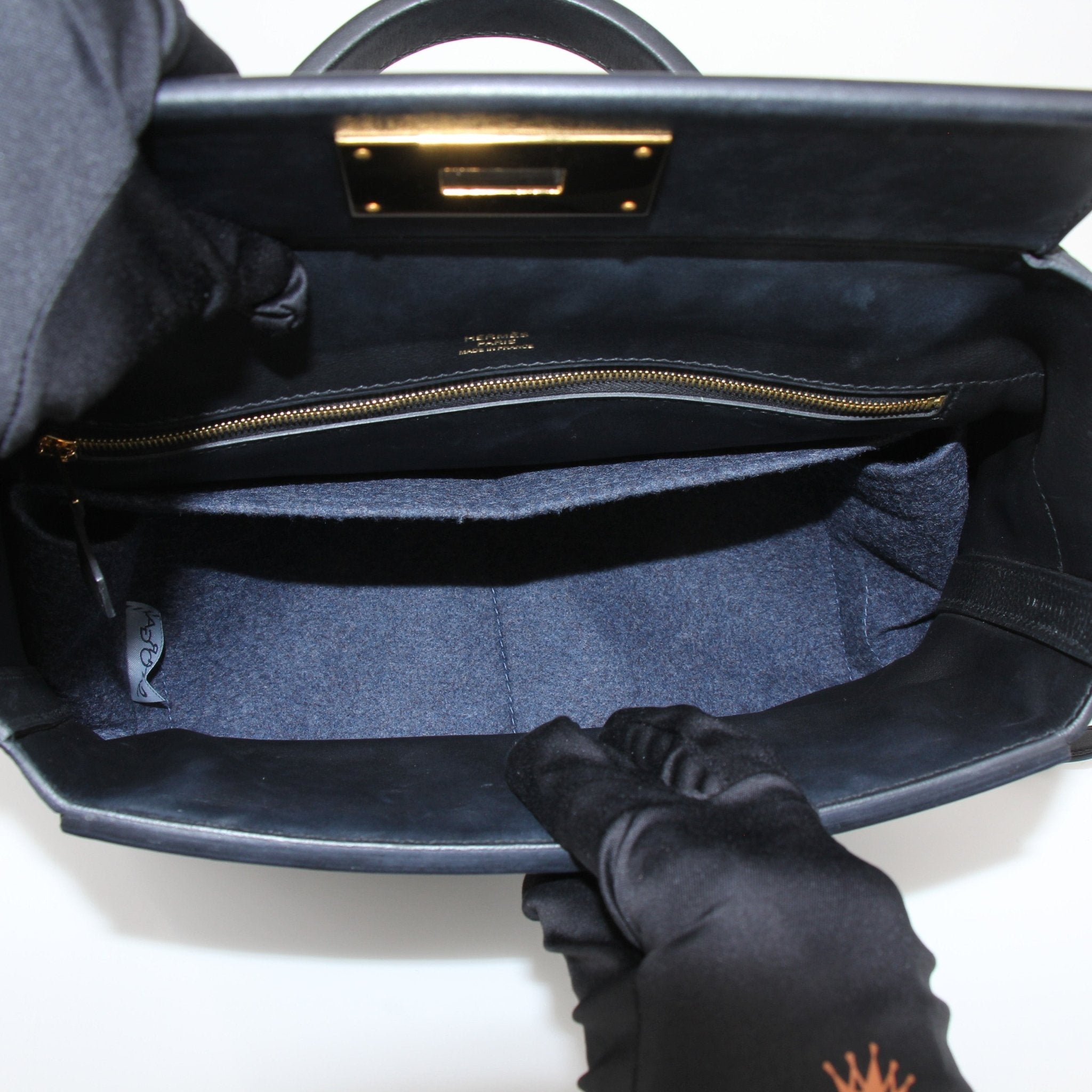 Hermès Top Handle Clemence handbag by Gold & Beyond, featuring a structured leather design with top handles and elegant craftsmanship.