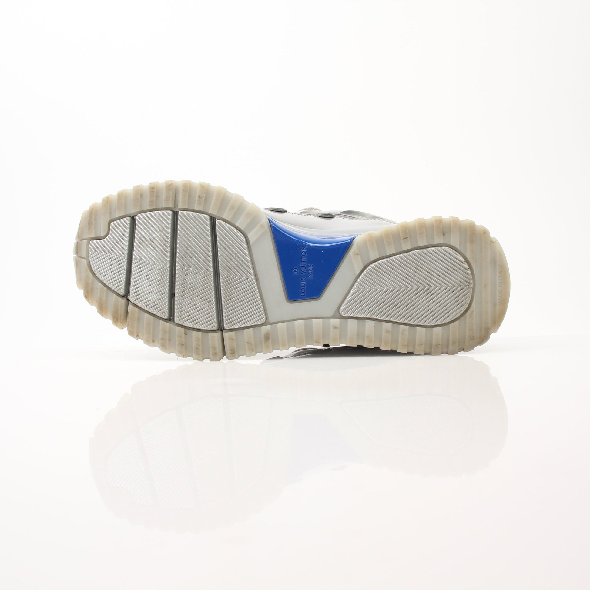Louis Vuitton Zig Zag Sneakers from Gold & Beyond, stylish shoes with bold zigzag pattern, featuring white soles and branded details.
