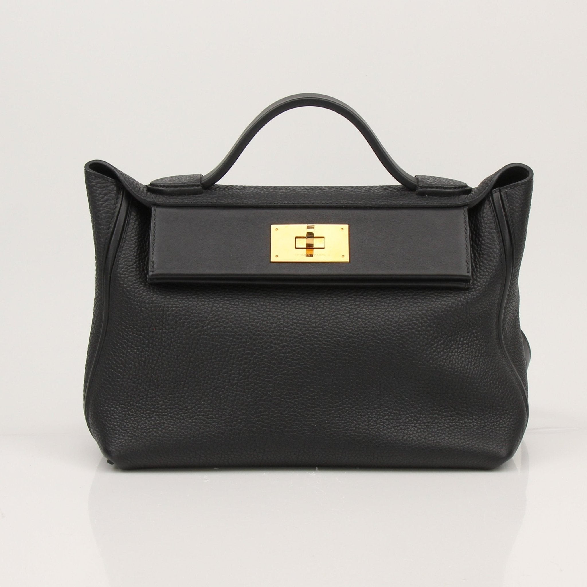 Hermès Top Handle Clemence handbag in luxurious leather, featuring gold hardware and elegant design by Gold & Beyond.