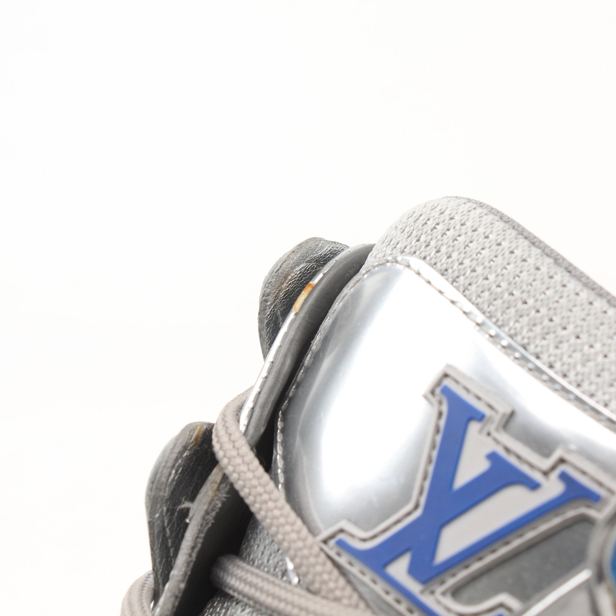 Gold & Beyond Louis Vuitton Zig Zag Sneakers, stylish shoes with bold zigzag pattern and white laces, displayed on a neutral background.