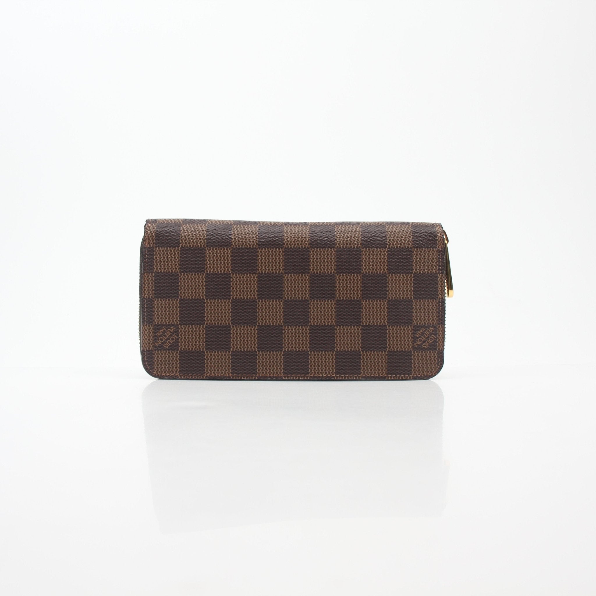 Louis Vuitton Damier Ebene Zippy Wallet with gold accents, featuring checkered pattern and multiple card slots.