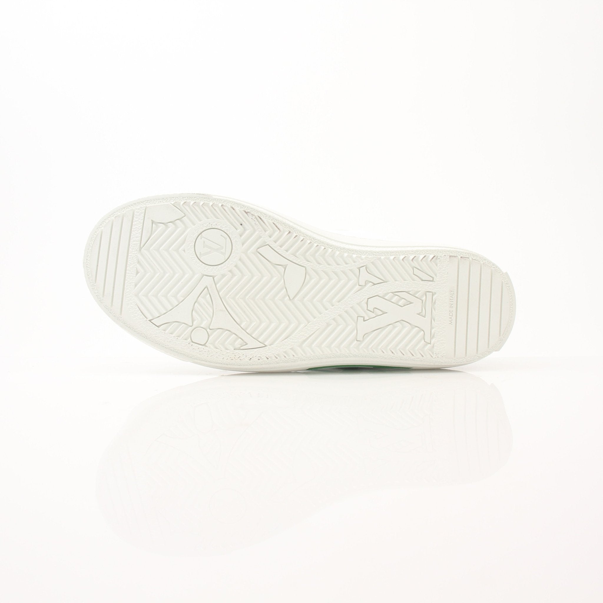 Gold & Beyond Louis Vuitton Charlie Sneakers featuring white leather uppers, stylish laces, and signature branding.