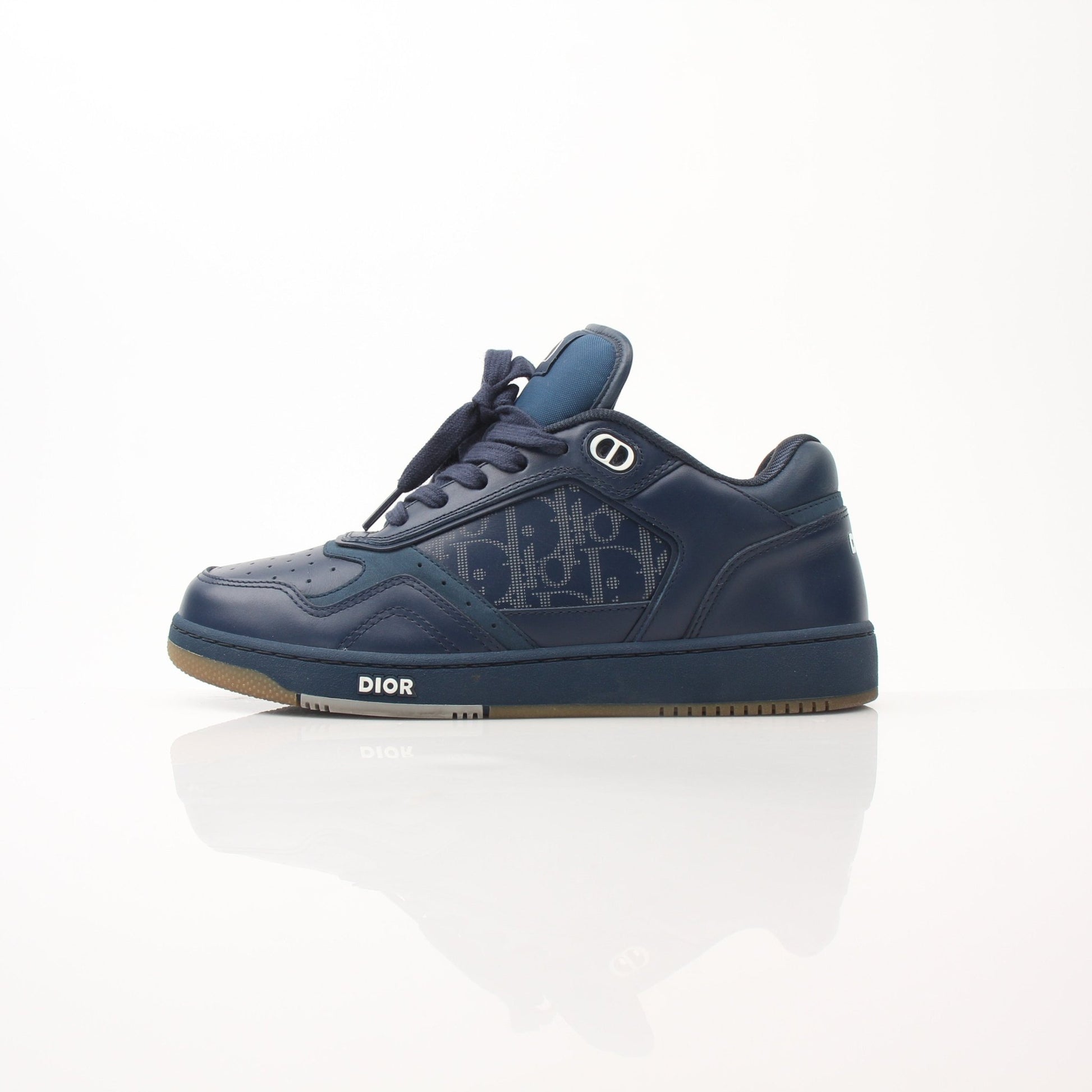 Christian Dior Navy Oblique Sneakers showing navy canvas with Dior monogram pattern and white rubber soles.