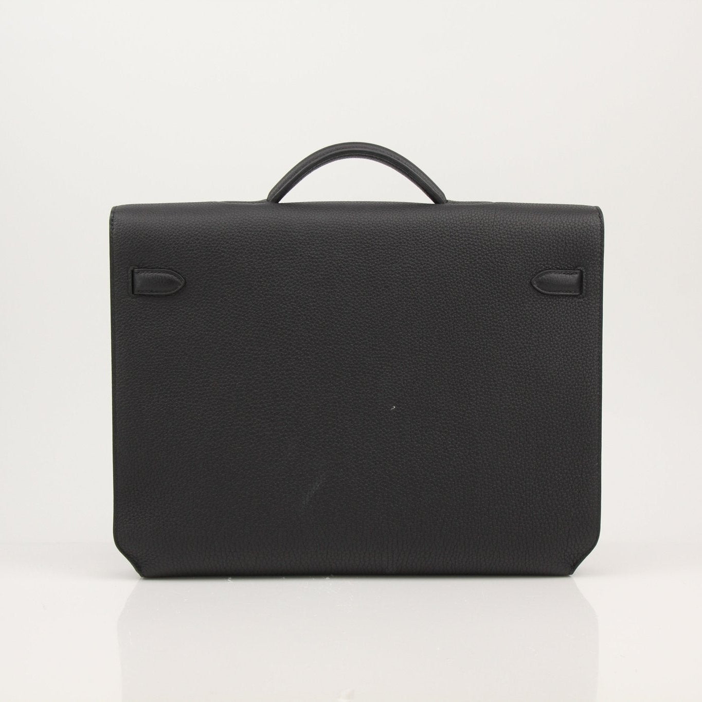 Gold & Beyond Hermès handbag with a sleek, structured design and top handle, perfect for professional and stylish use.