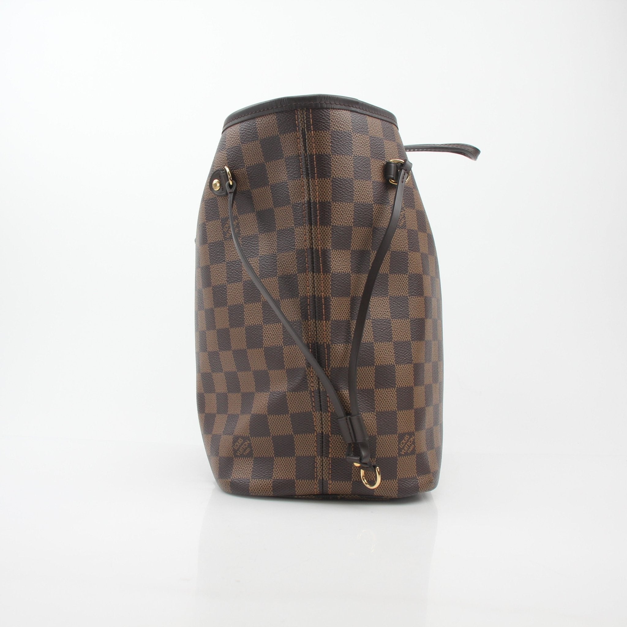 Louis Vuitton Damier Ebene Neverfull MM tote handbag with leather trim and spacious interior, displayed on a neutral background.