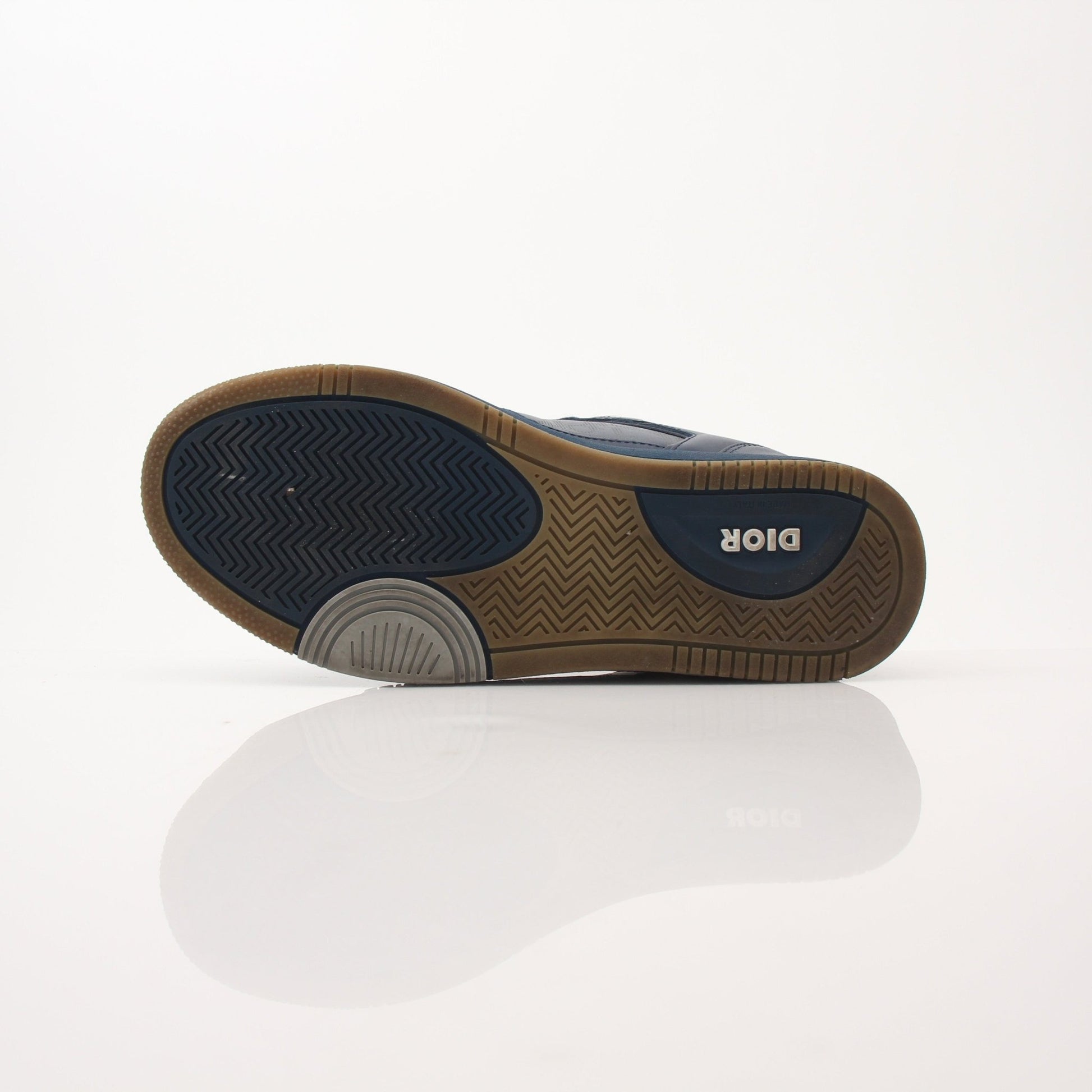 Christian Dior Navy Oblique Sneakers featuring navy fabric with Dior's signature oblique pattern and white rubber soles.