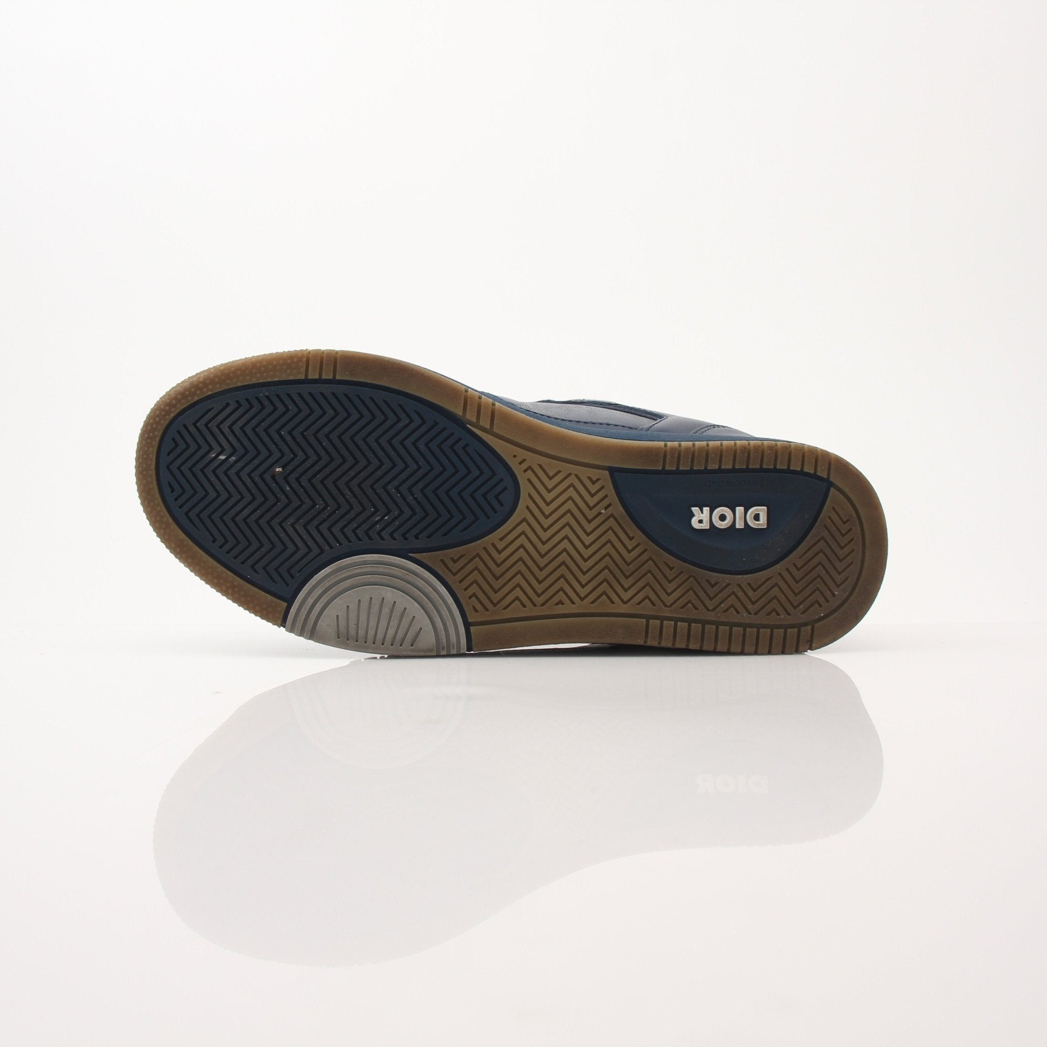 Christian Dior Navy Oblique Sneakers featuring navy fabric with Dior's signature oblique pattern and white rubber soles.