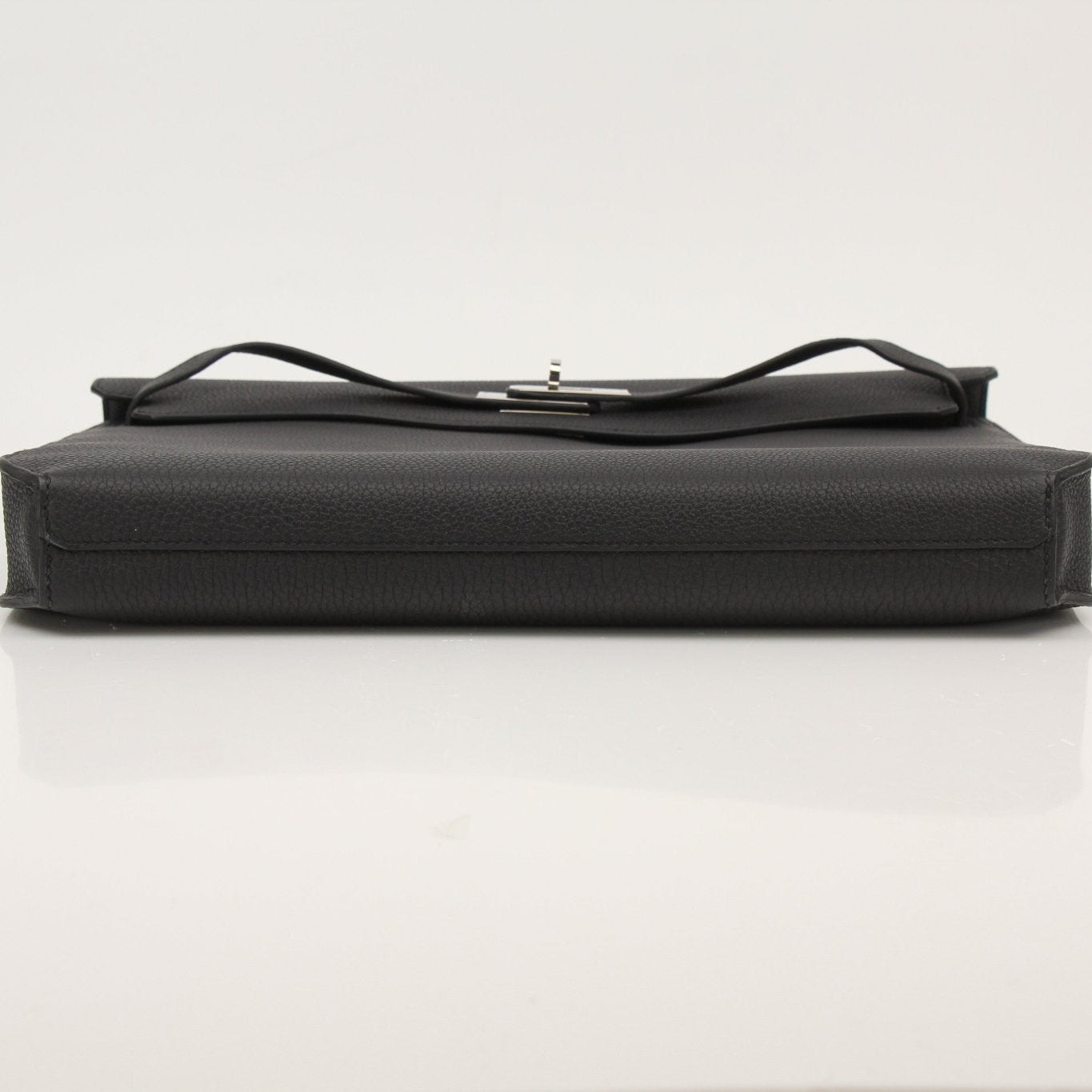 Gold & Beyond Hermès Sac à Dépêches briefcase handbag with sleek leather design and elegant gold hardware.