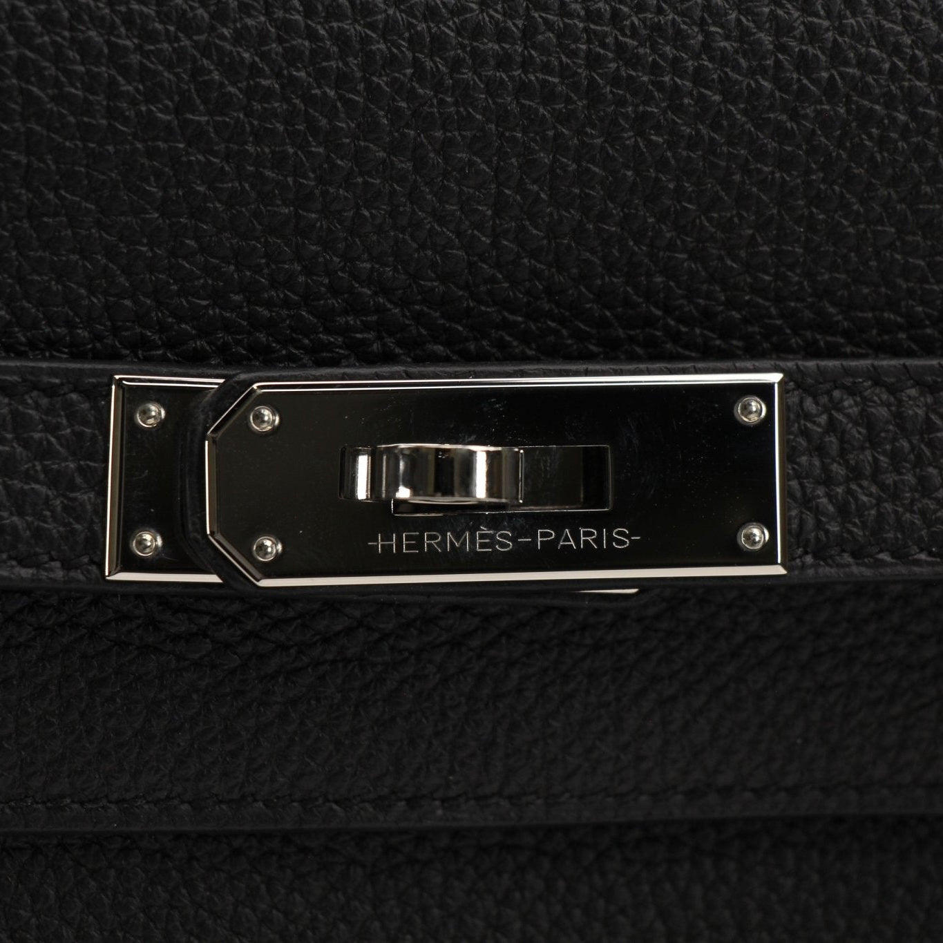 Gold & Beyond Hermès Sac à Dépêches briefcase handbag with elegant leather design and top handle, showcased in the image.