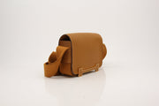 Hermès Geta 21 gold handbag by Gold & Beyond, featuring sleek design and luxurious gold accents, shown on a neutral background.