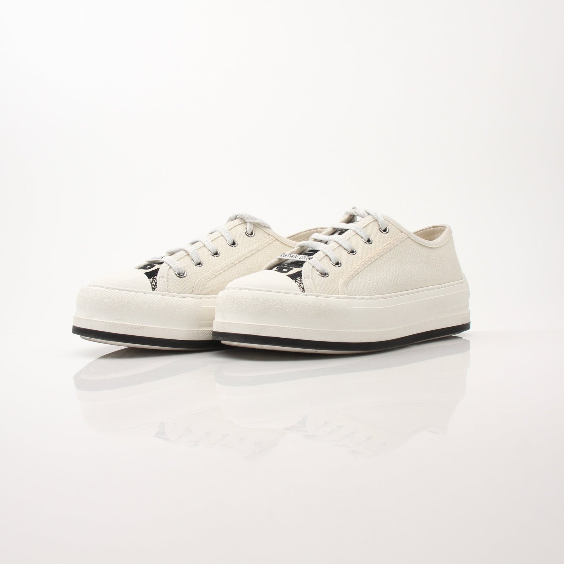 Christian Dior Walk’n’Dior platform sneakers in white with gold accents, showcasing the stylish shoe design and chunky sole.