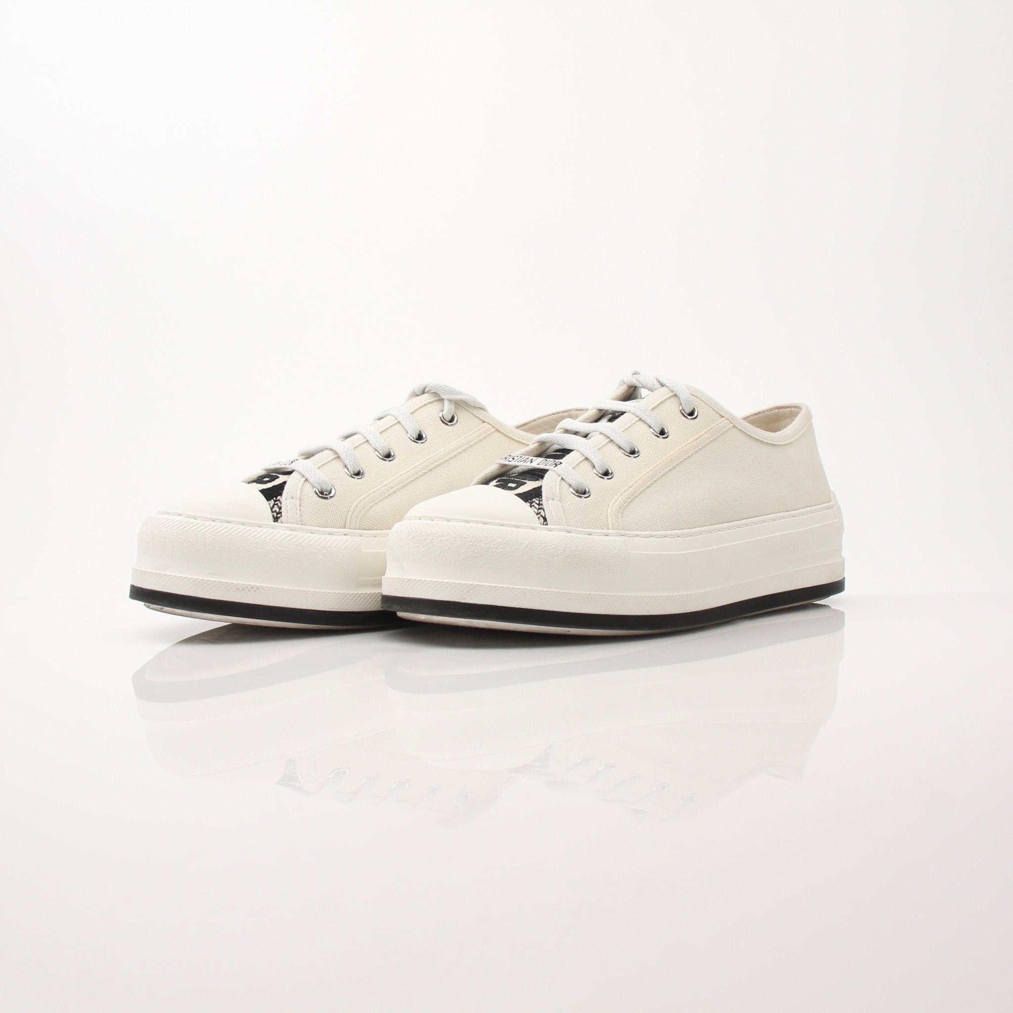 Christian Dior Walk’n’Dior platform sneakers in white with gold accents, showcasing the stylish shoe design and chunky sole.