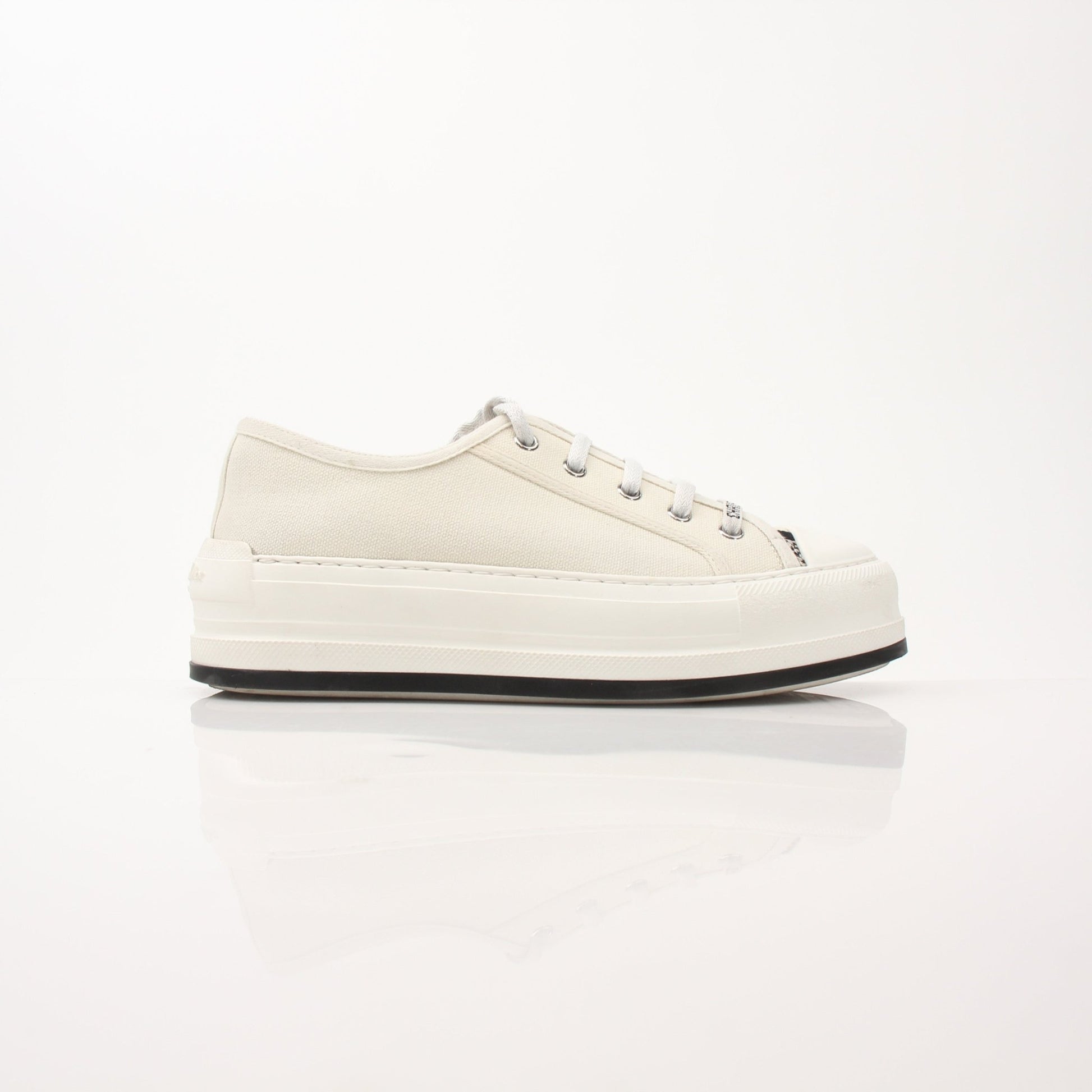 Christian Dior Walk’n’Dior platform sneakers in white with gold accents, featuring chunky soles and stylish design.