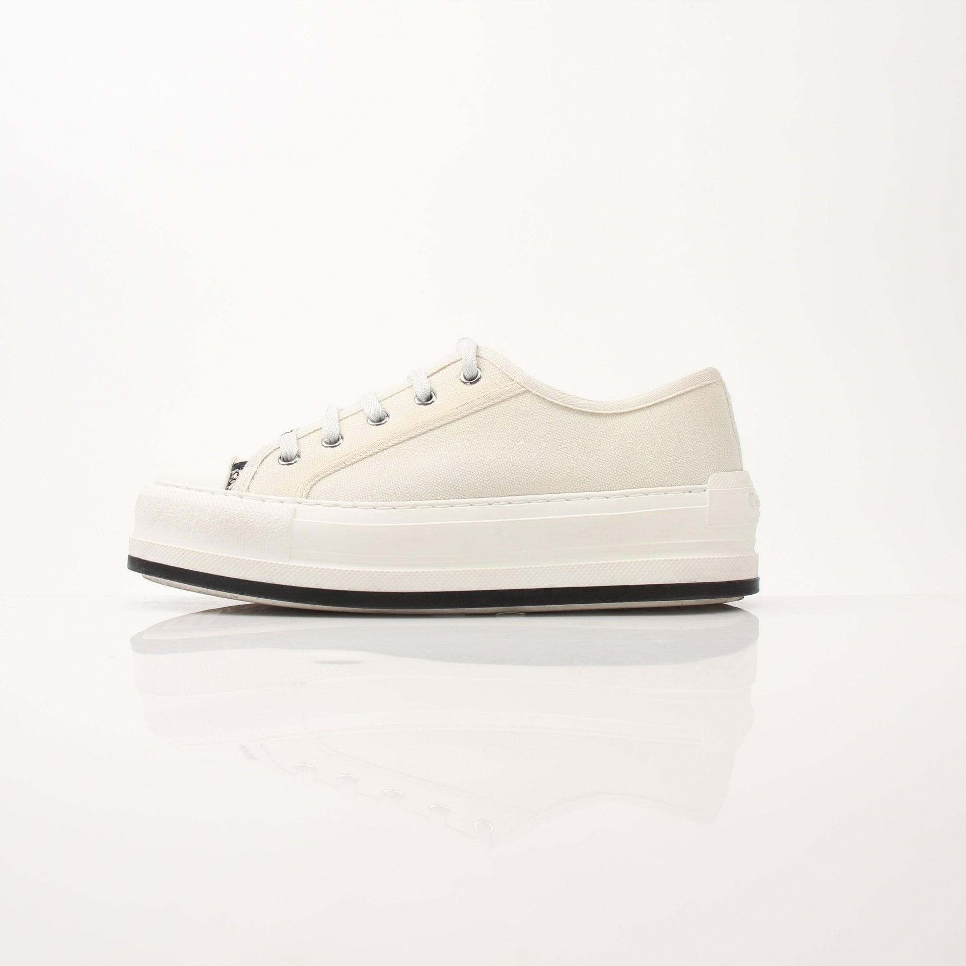 Christian Dior Walk’n’Dior platform sneakers in white with gold accents, featuring a chunky sole and stylish design.