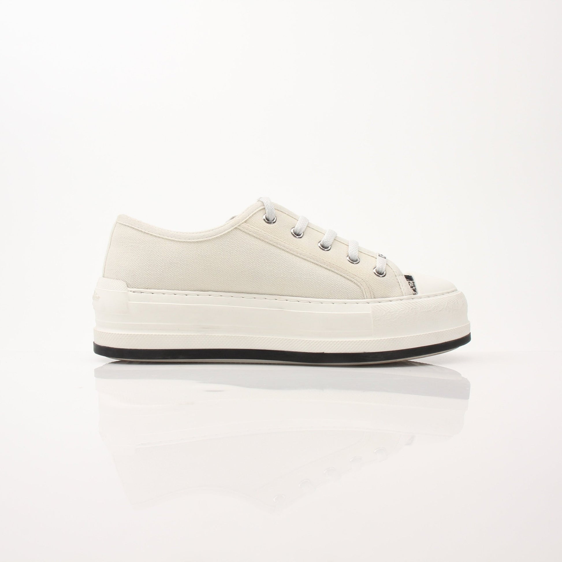 Christian Dior Walk’n’Dior platform sneakers with gold accents, stylish shoes featuring a modern design and chunky soles.