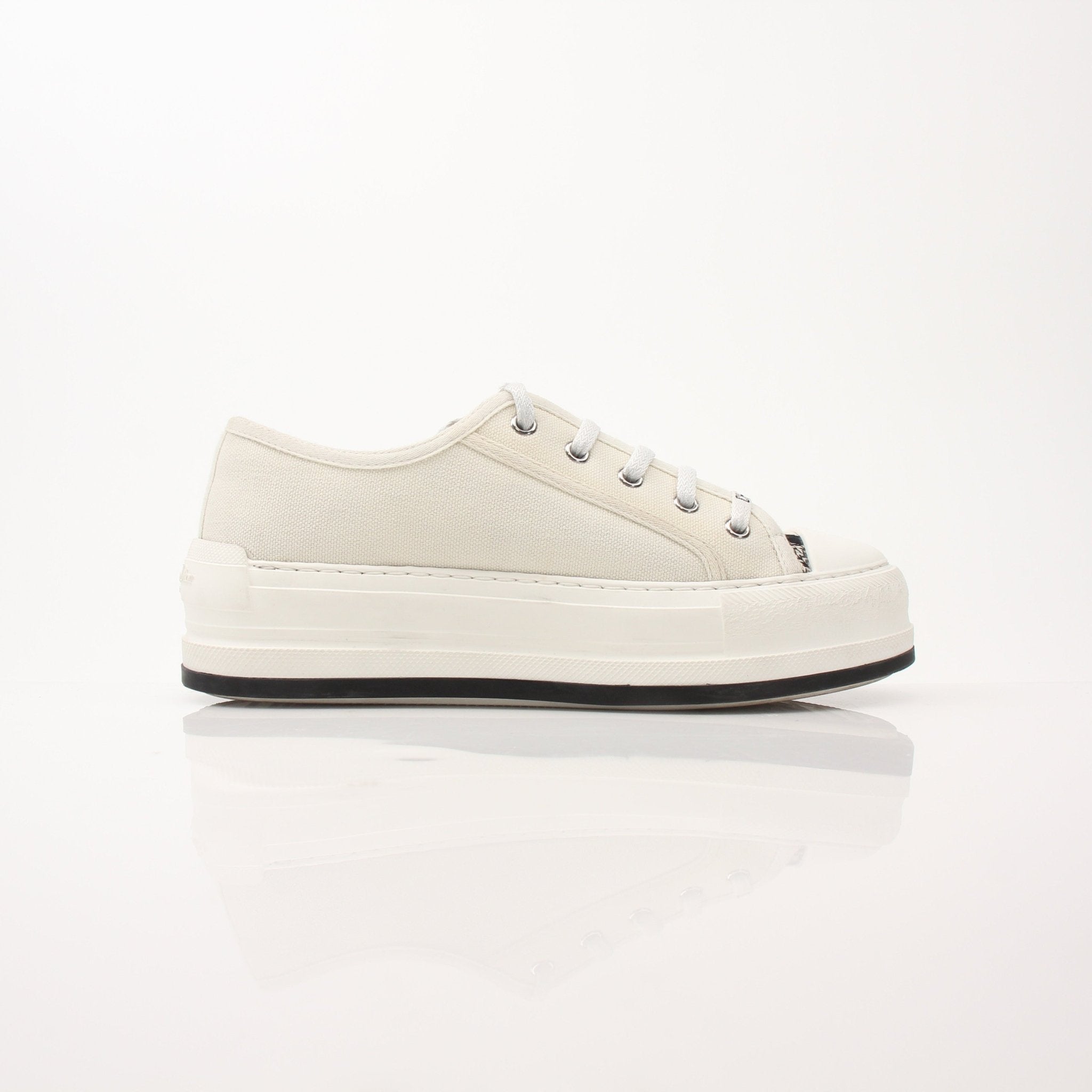 Christian Dior Walk’n’Dior platform sneakers with gold accents, stylish shoes featuring a modern design and chunky soles.
