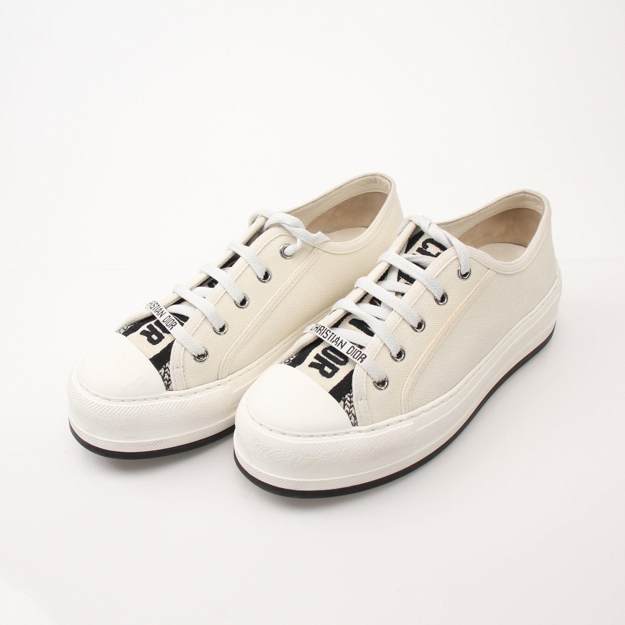 Christian Dior Walk’n’Dior platform sneakers by Gold & Beyond, showing black shoes with white soles and Dior branding.