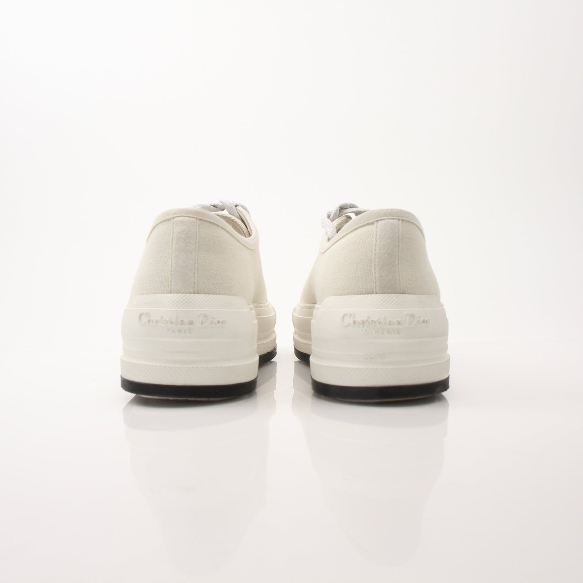 Christian Dior Walk’n’Dior platform sneakers in white with gold accents, showcased on a neutral background.