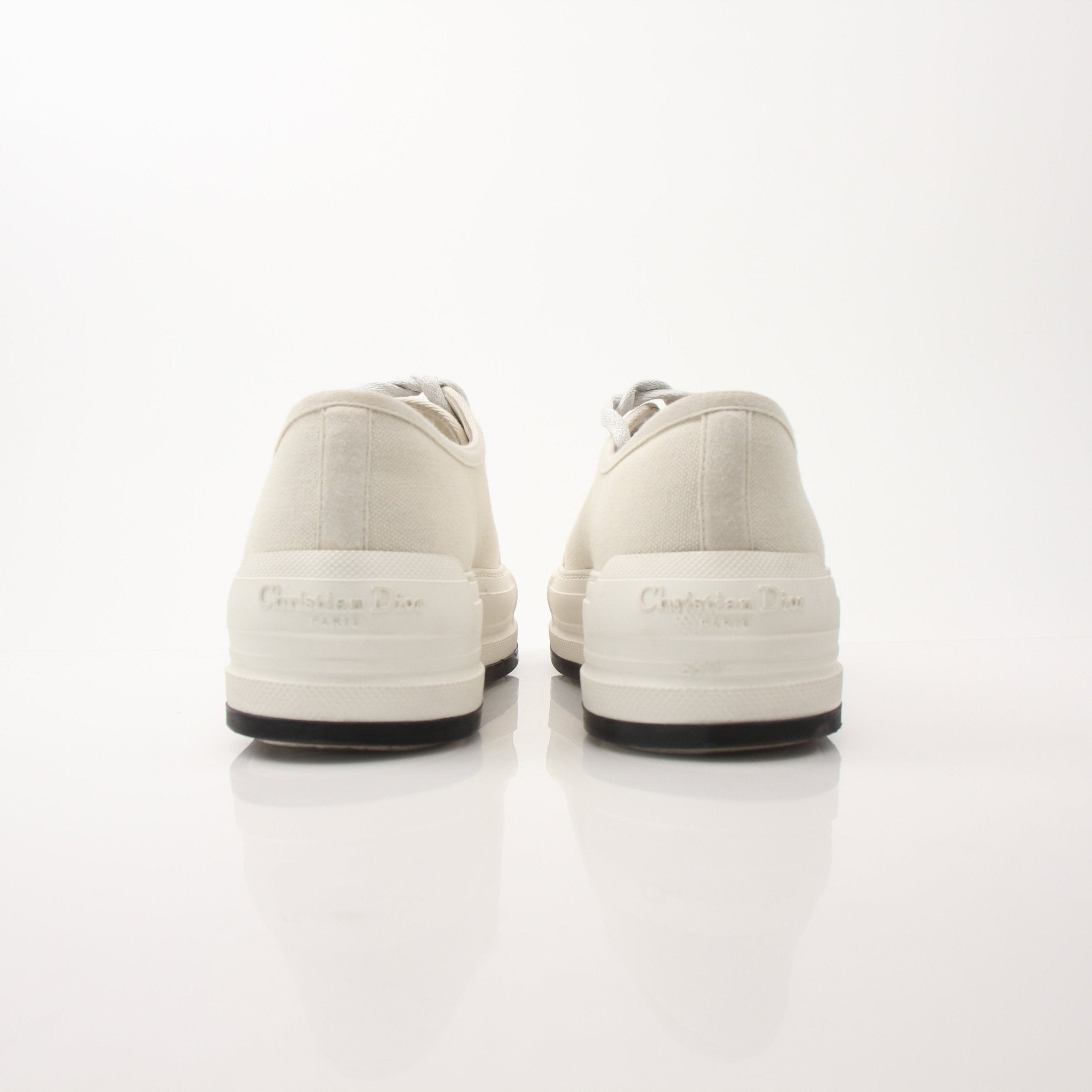 Christian Dior Walk’n’Dior platform sneakers in white with gold accents, showcased on a neutral background.