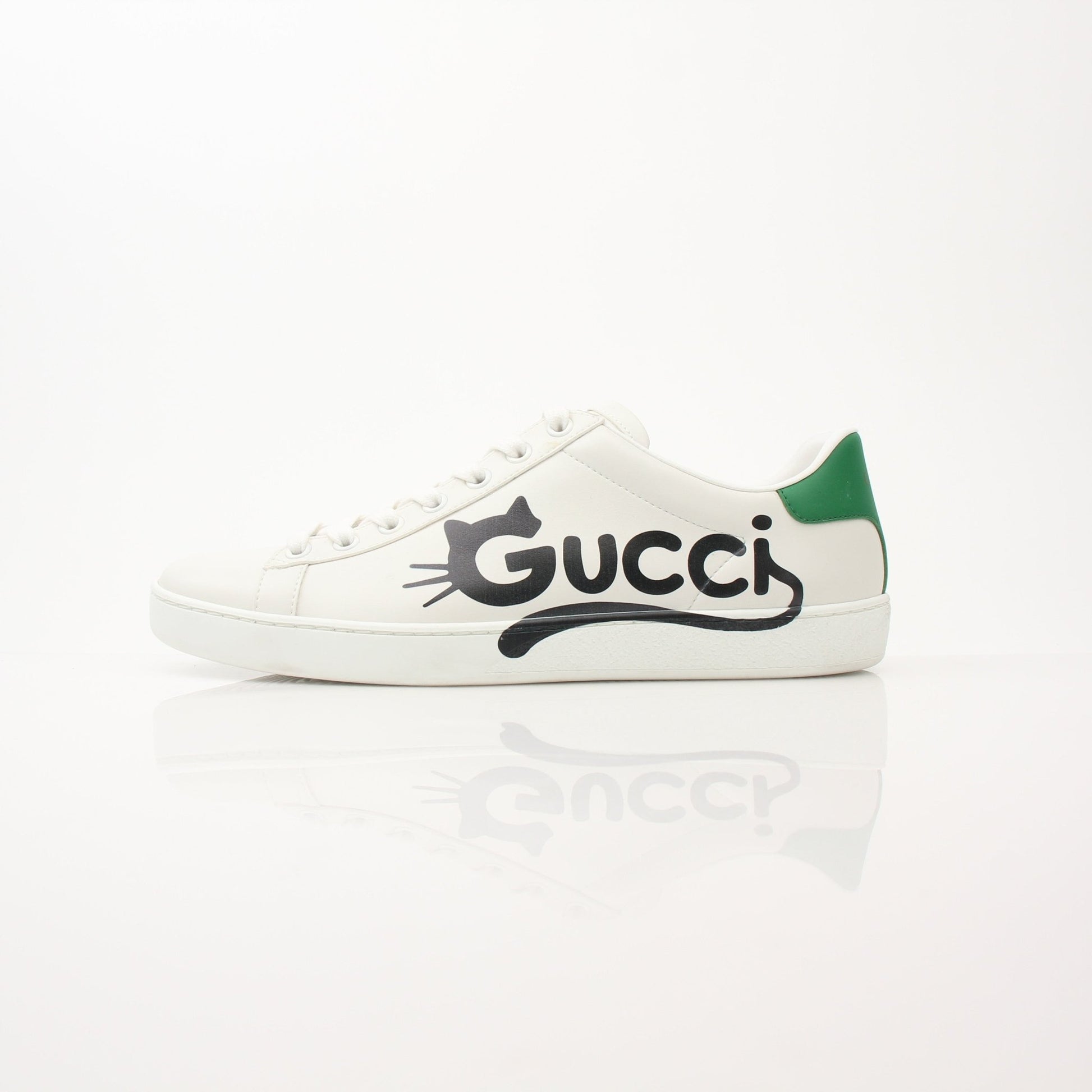 Gold & Beyond Gucci women’s Ace kitten logo sneakers, stylish white shoes with signature gold logo detail, casual and trendy footwear
