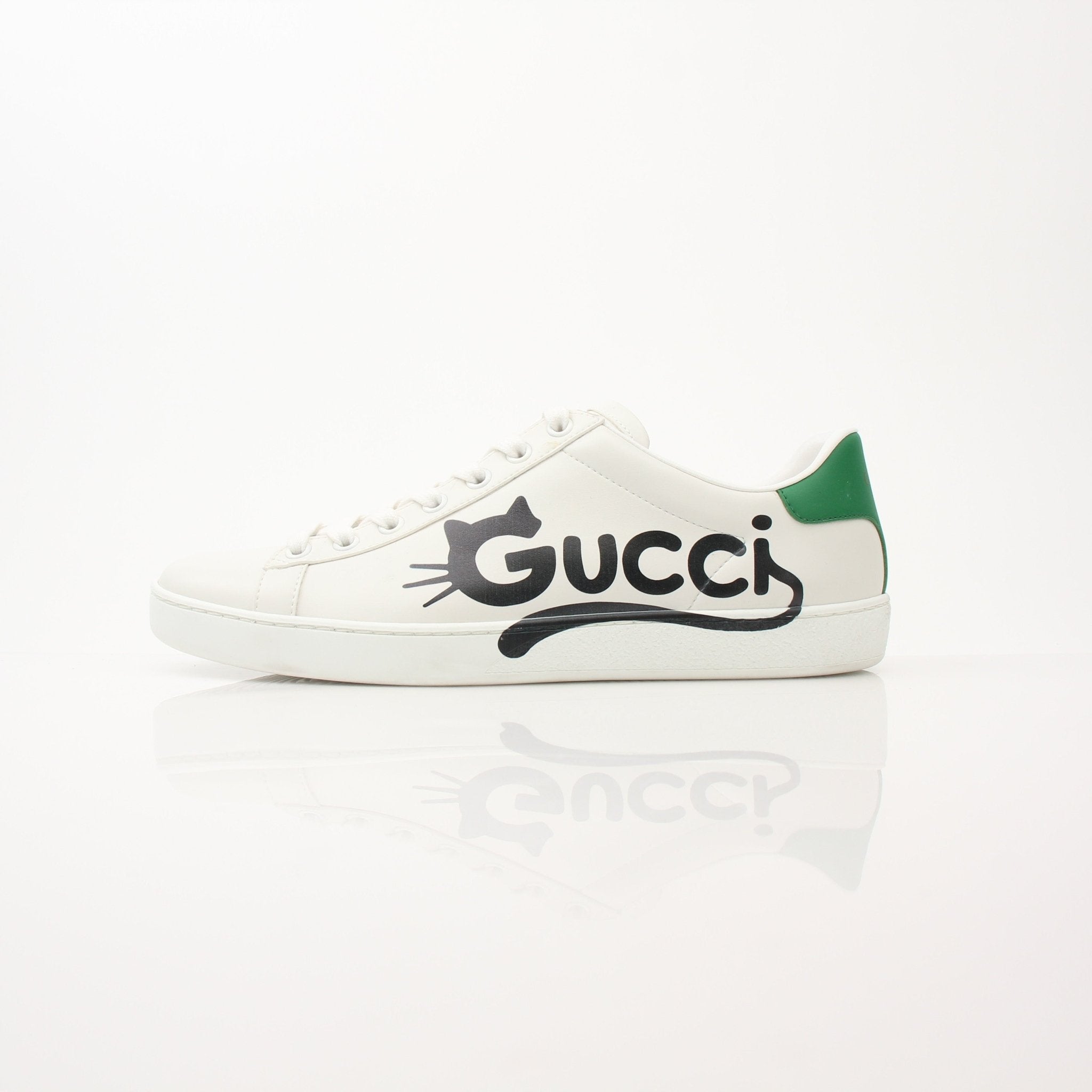 Gold & Beyond Gucci women’s Ace kitten logo sneakers, stylish white shoes with signature gold logo detail, casual and trendy footwear