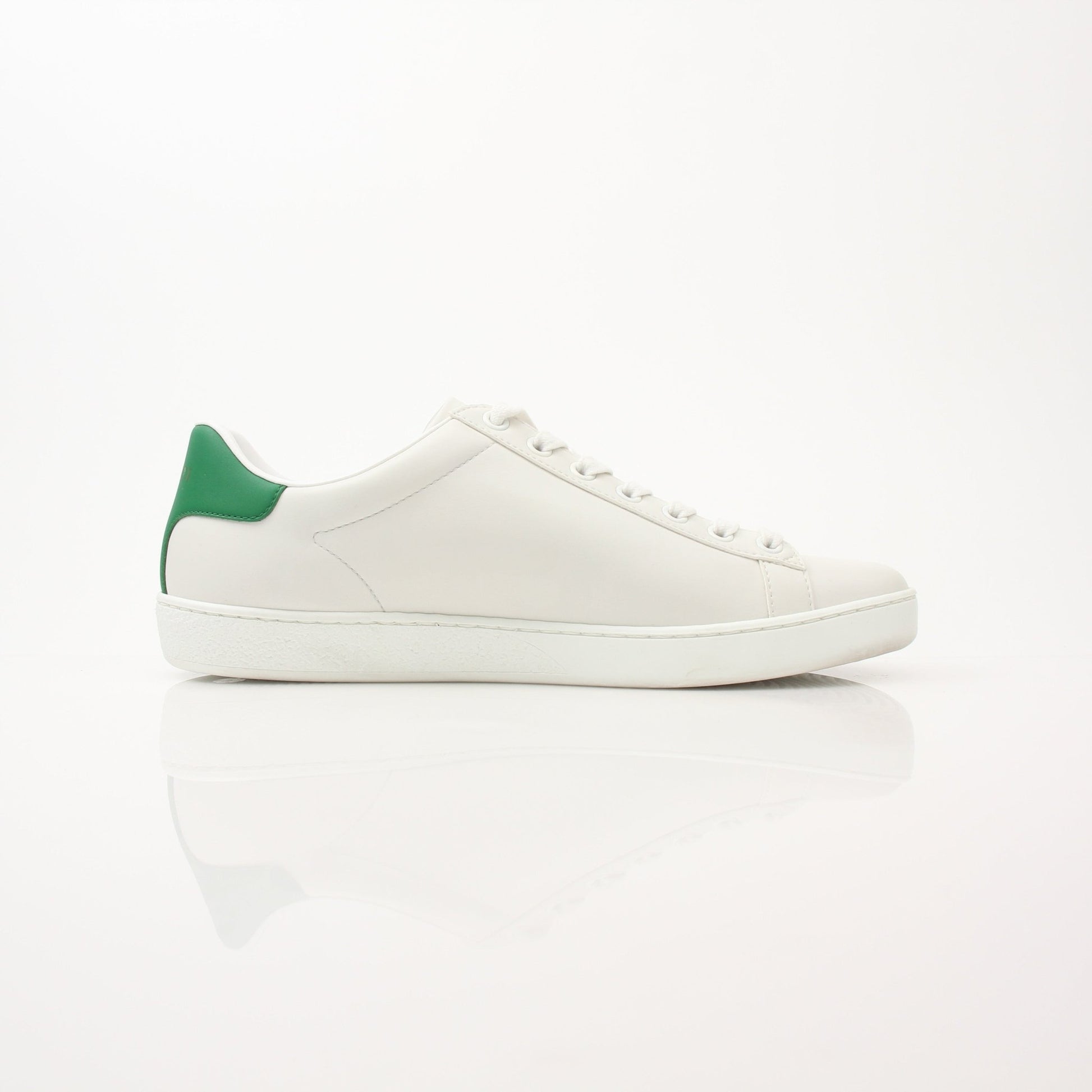 Gold & Beyond Gucci women’s Ace kitten logo sneakers, stylish shoes with signature branding and white laces on a clean background.