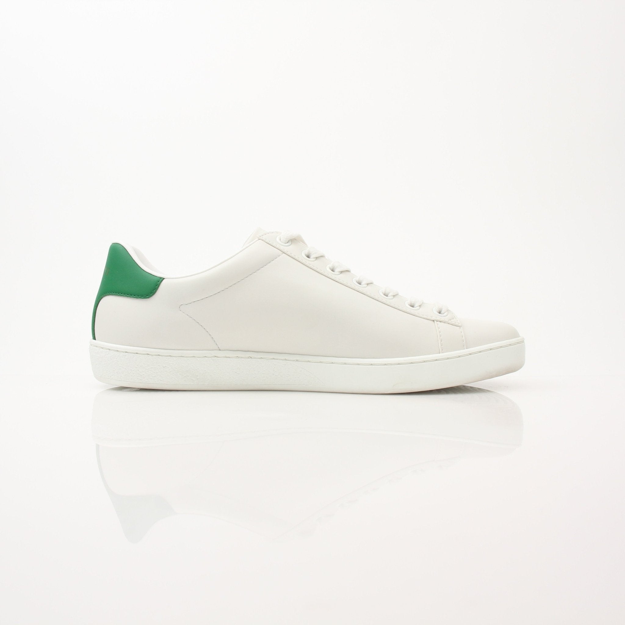 Gold & Beyond Gucci women’s Ace kitten logo sneakers, stylish shoes with signature branding and white laces on a clean background.