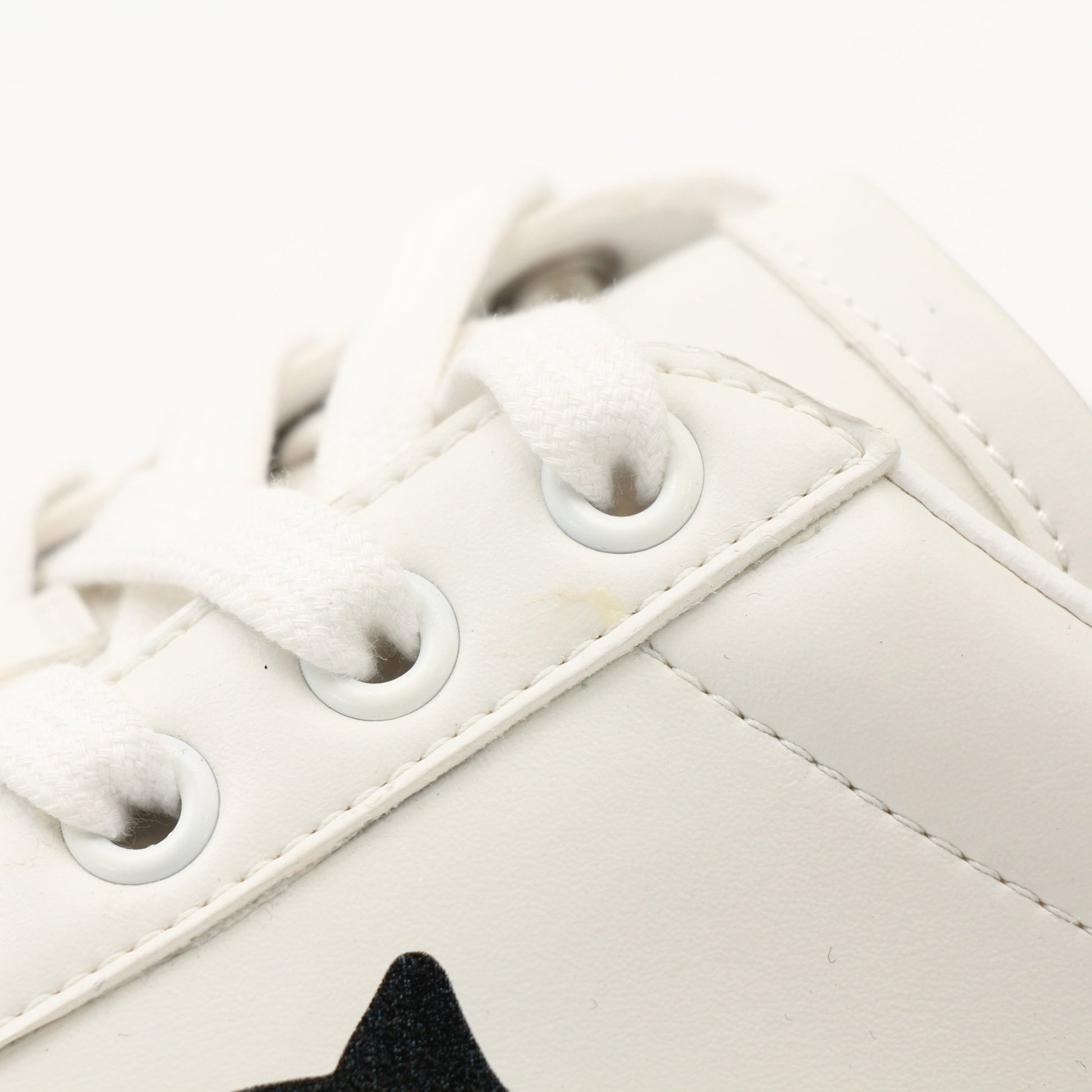 Gold & Beyond Gucci women’s Ace kitten logo sneakers with white leather and signature green and red stripe details.