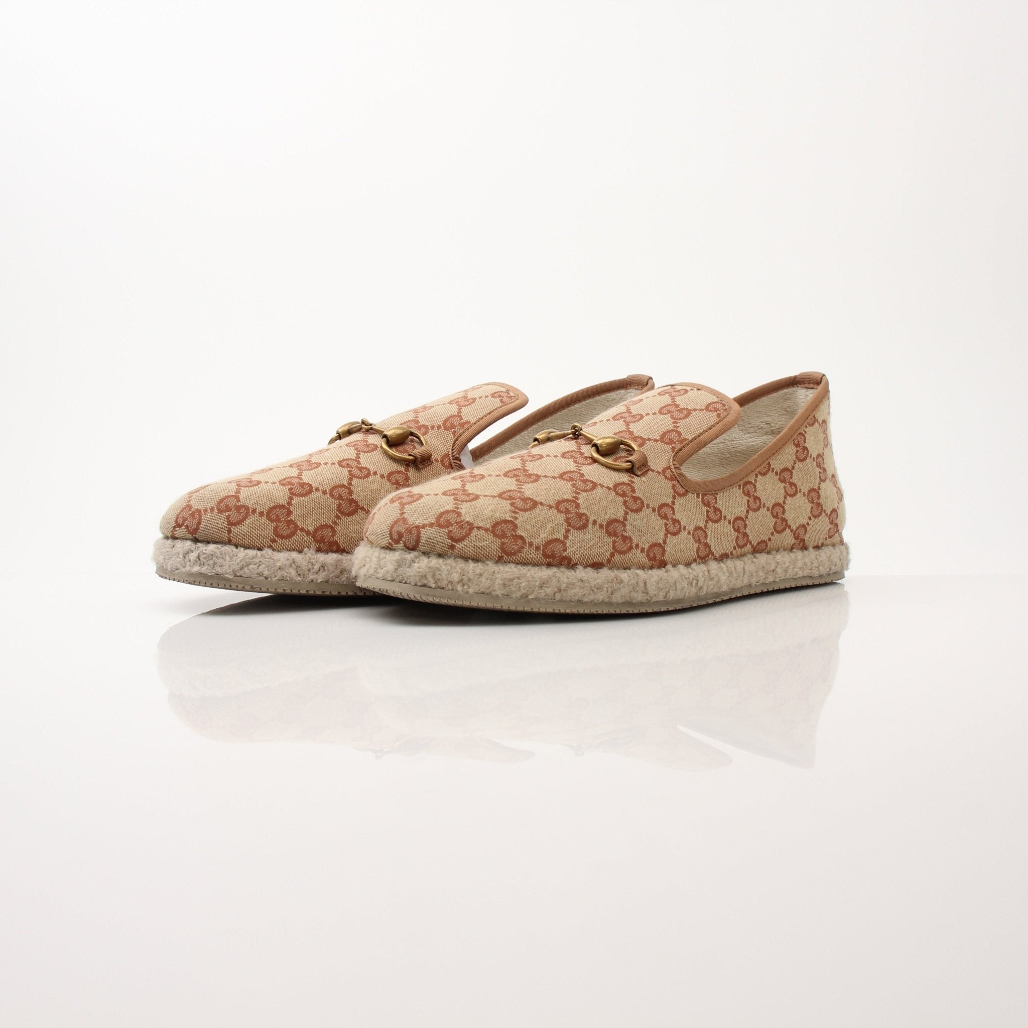Gold & Beyond Gucci men's GG Fria loafers, stylish shoes with classic design and leather detailing, shown on a neutral background.