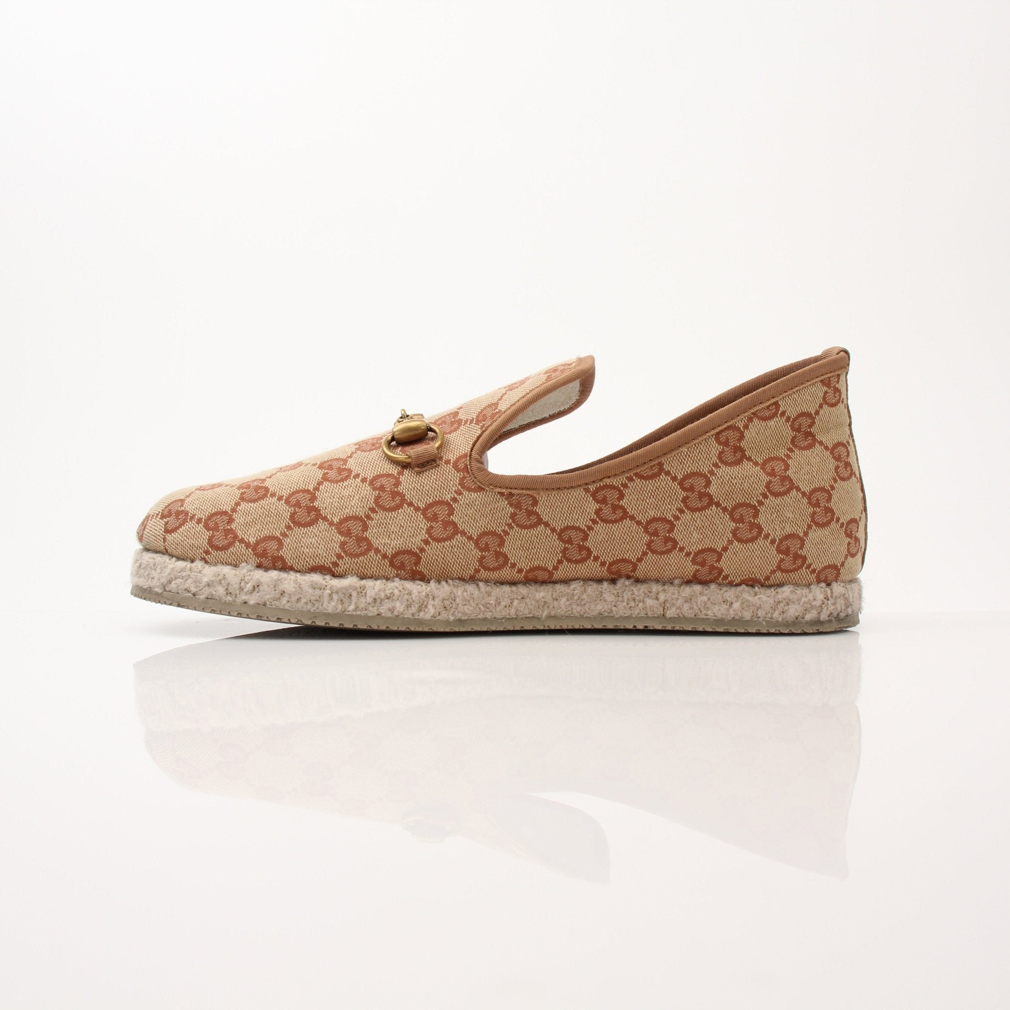 Gold & Beyond Gucci men's GG Fria loafers, stylish leather shoes with signature GG branding, displayed on a neutral background.