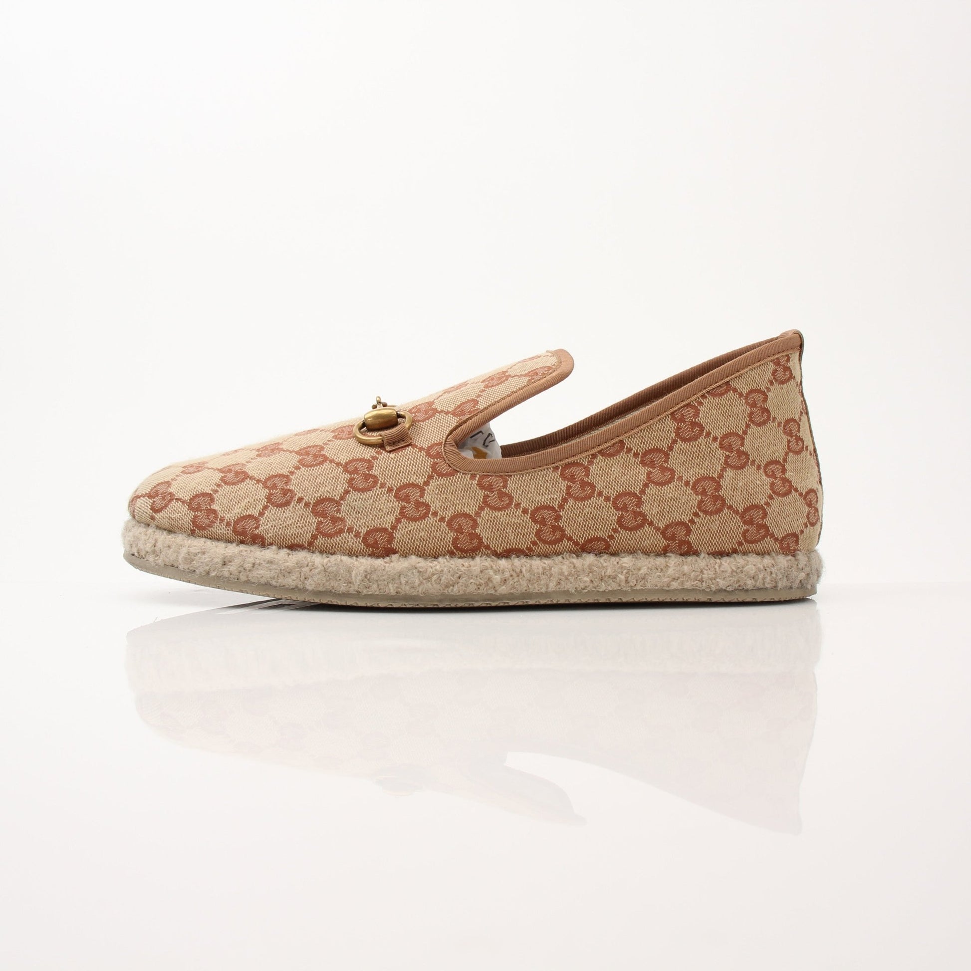 Gucci Men’s GG Fria Loafers shoes in black leather with gold logo accents, displayed on a neutral background.