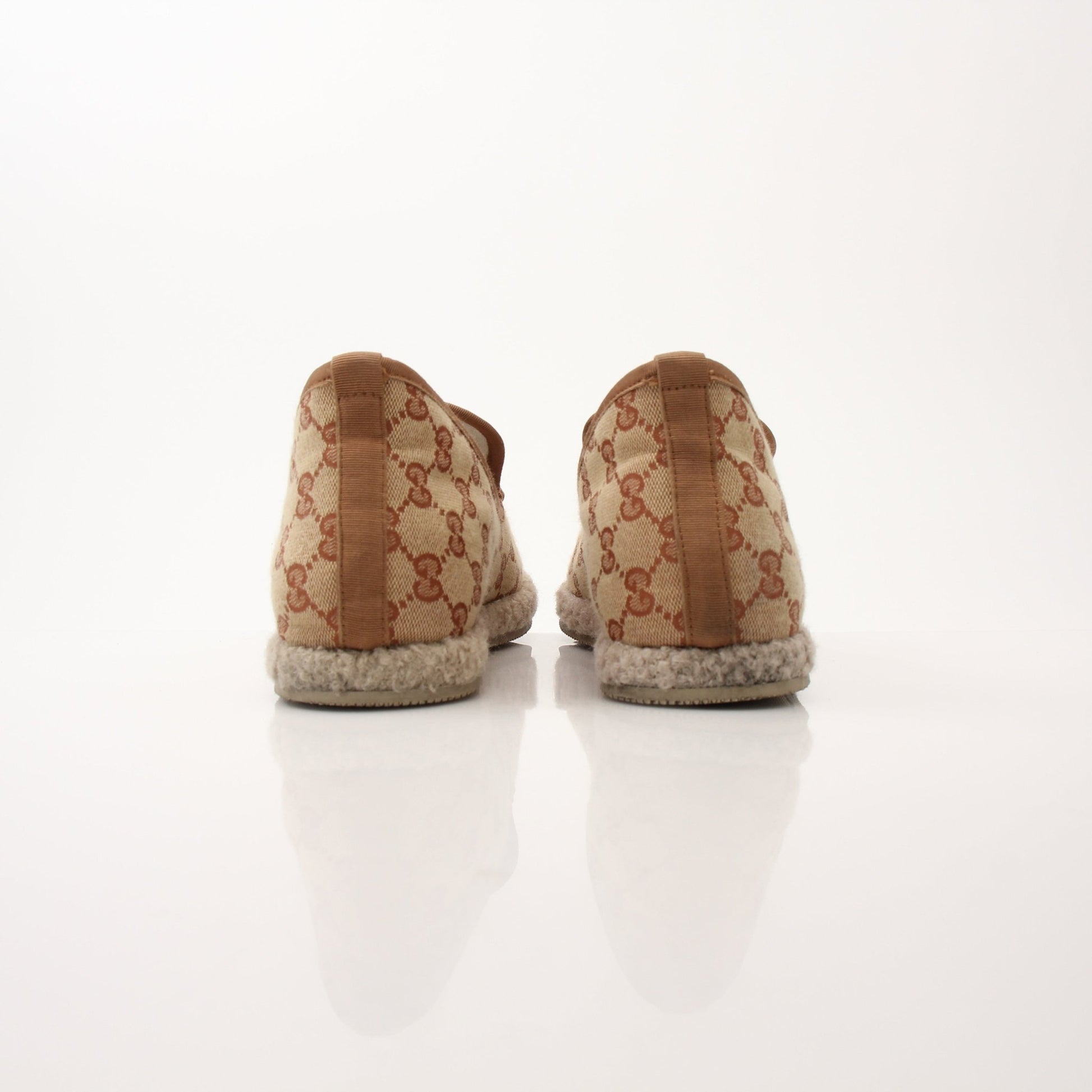 Gold & Beyond men's Gucci GG Fria loafers shoes featuring classic design and stylish leather detailing.