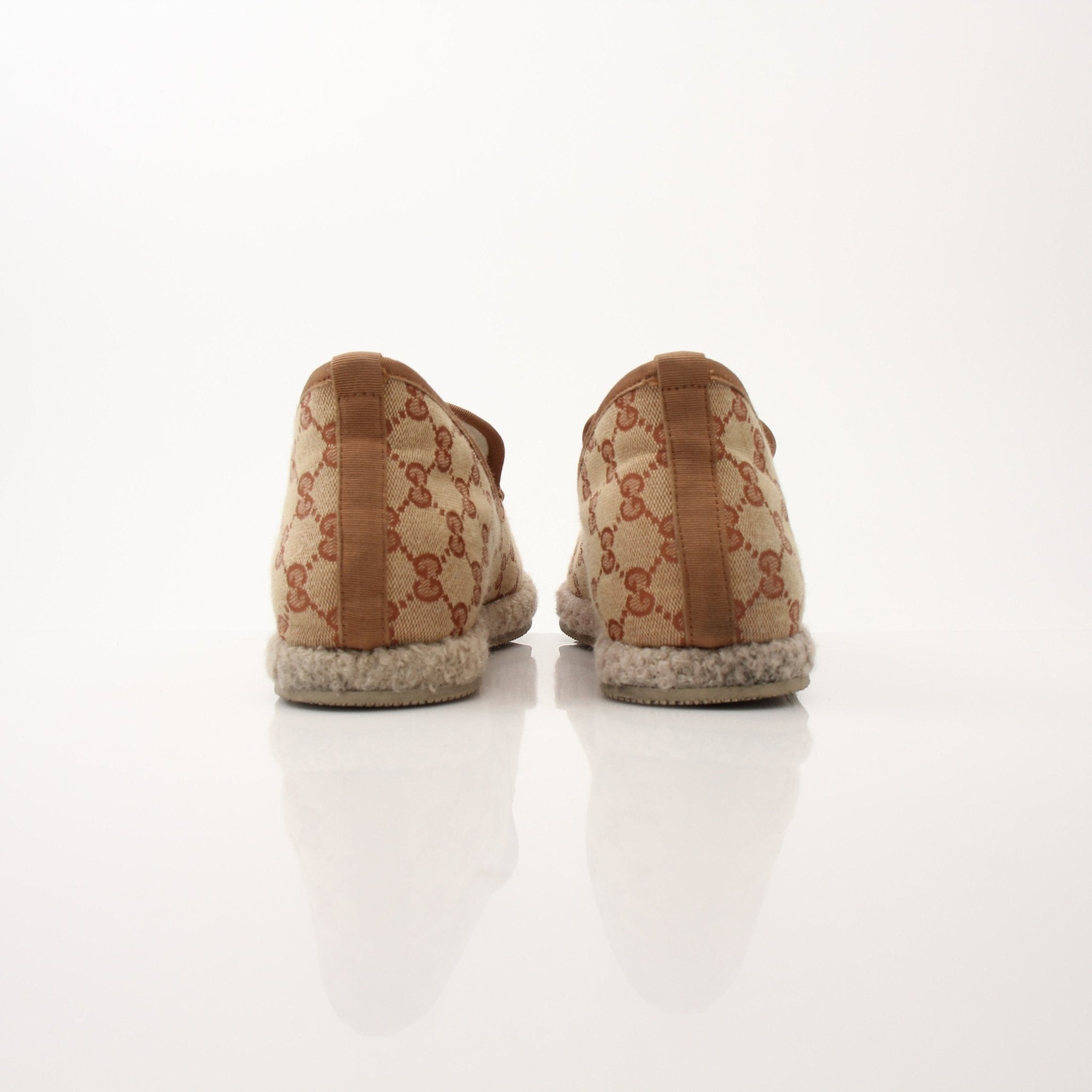 Gold & Beyond men's Gucci GG Fria loafers shoes featuring classic design and stylish leather detailing.
