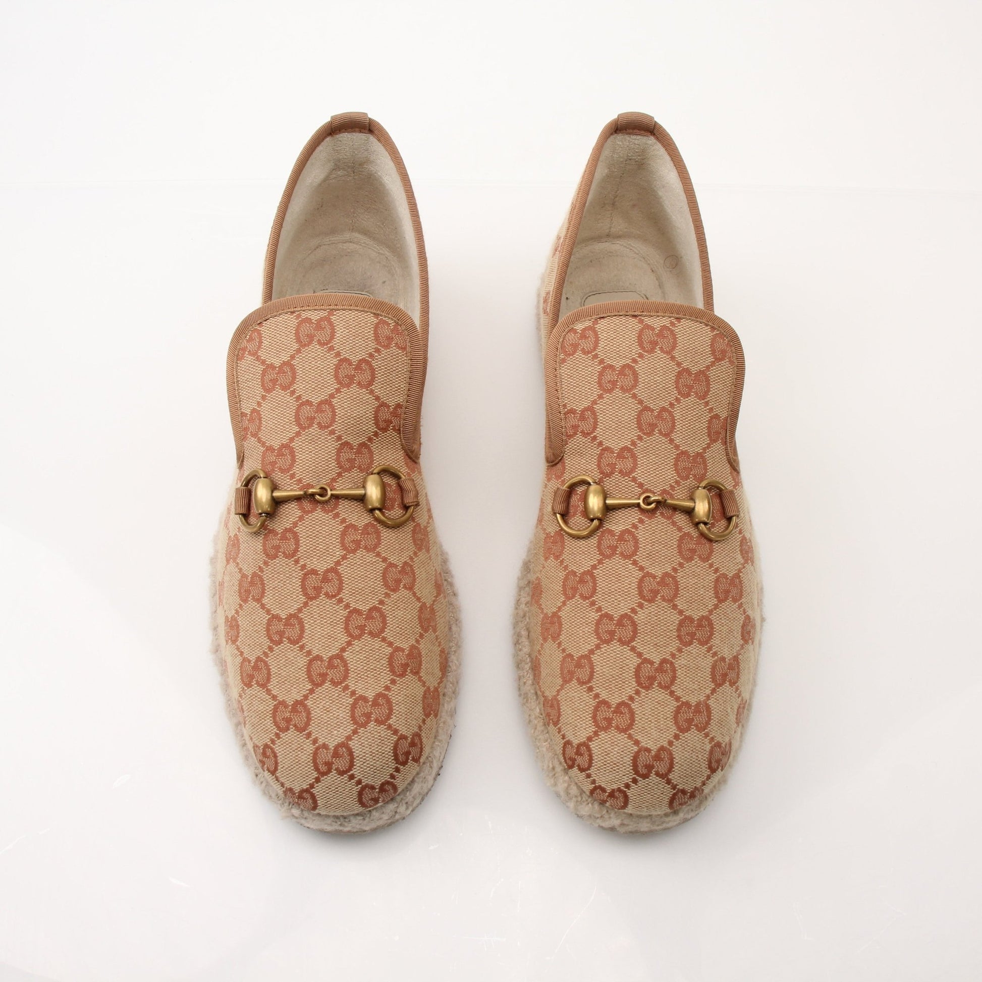 Gold & Beyond Gucci men's GG Fria loafers shoes, stylish leather slip-ons with classic GG pattern and sleek design.
