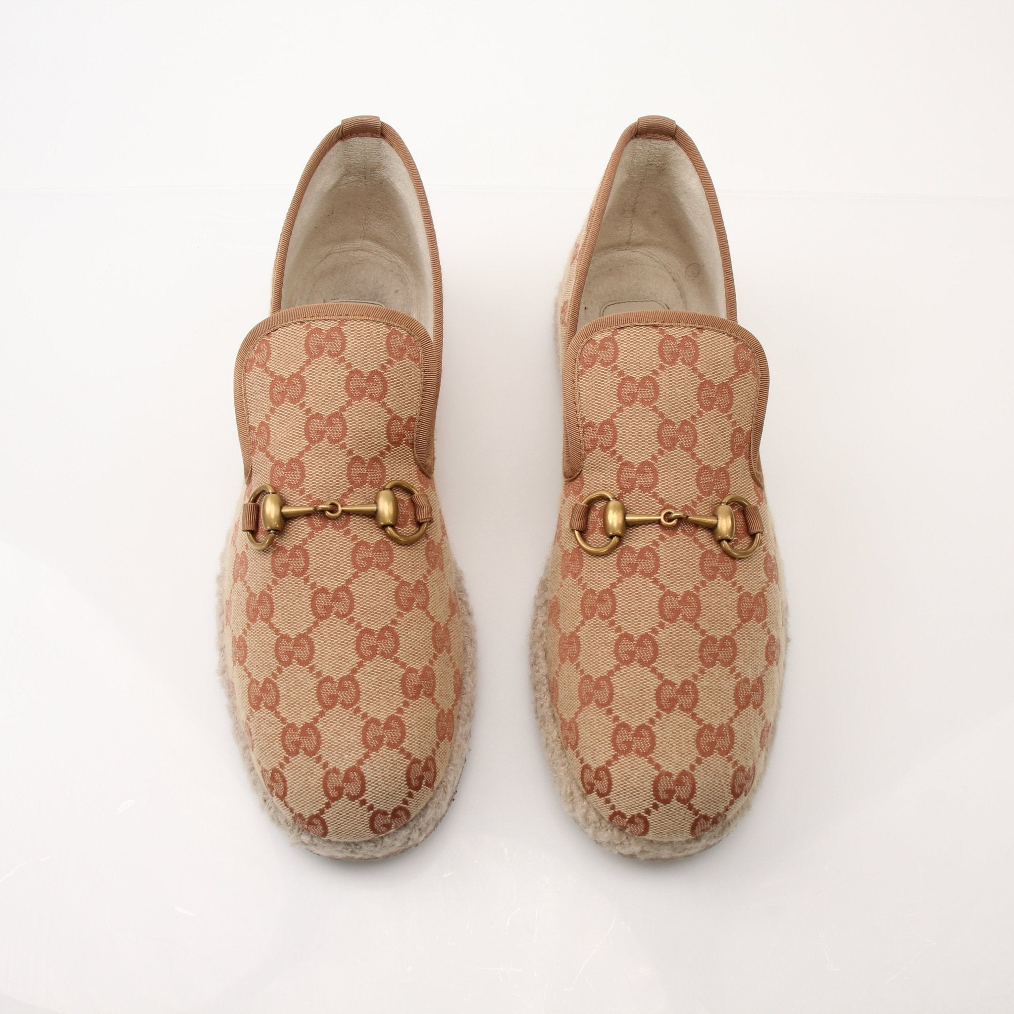Gold & Beyond Gucci men's GG Fria loafers shoes, stylish leather slip-ons with classic GG pattern and sleek design.