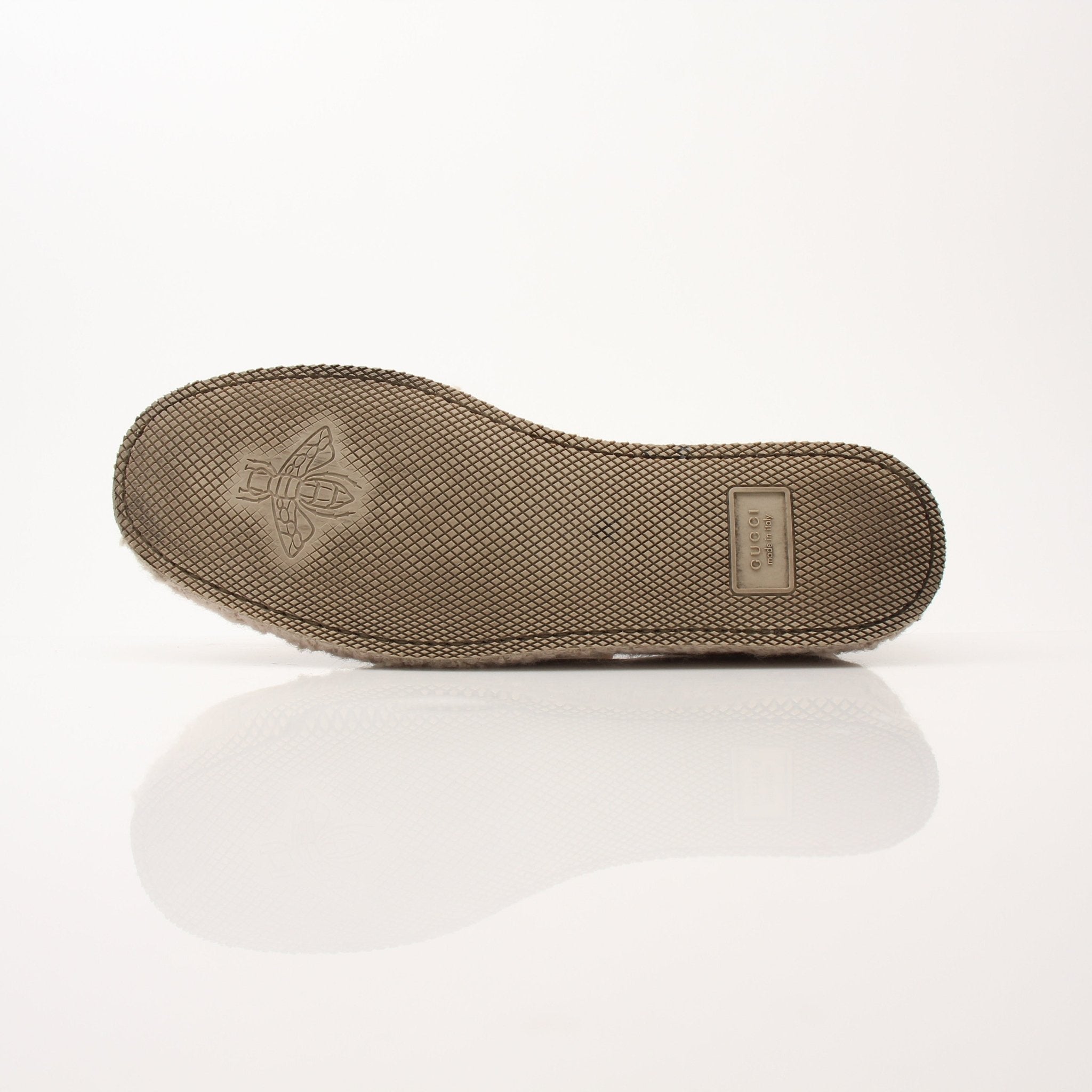 Gold & Beyond Gucci men's GG Fria loafers, stylish leather shoes with classic design and signature branding, shown from a side view.